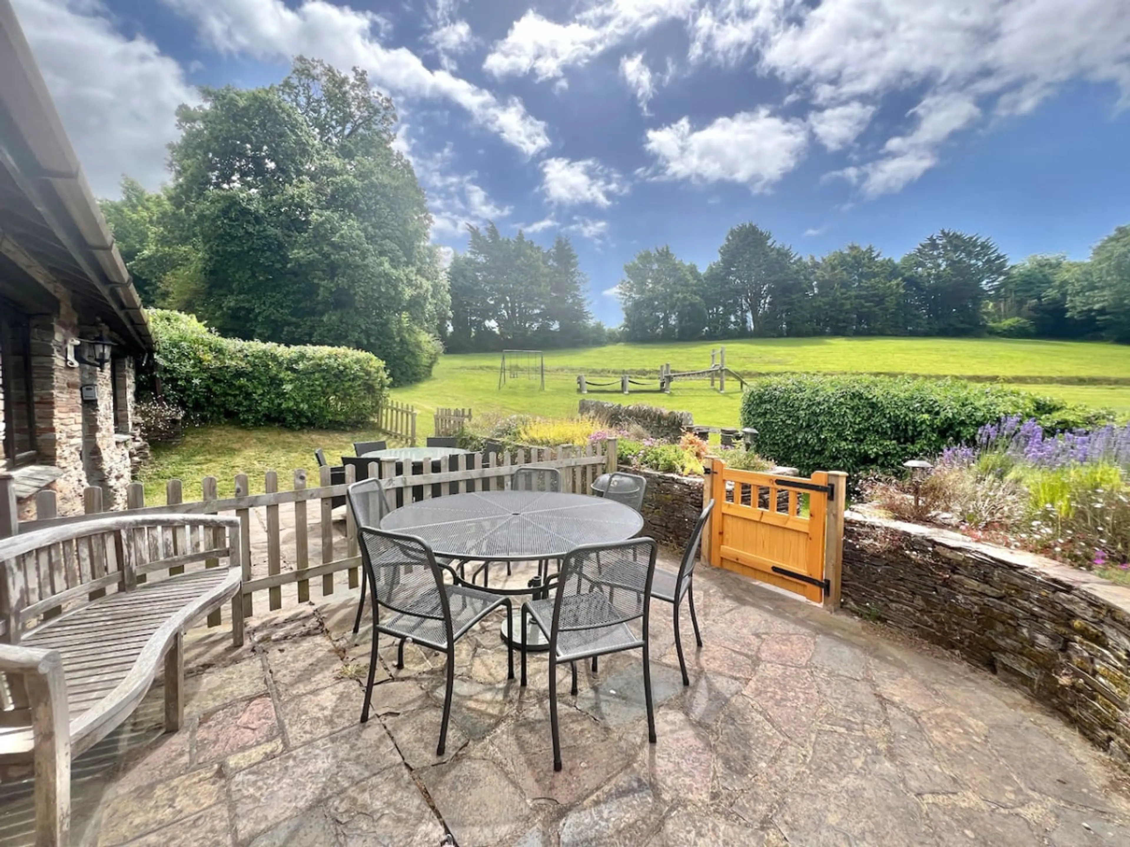 Dine alfresco whilst watching the children play on the climbing frame and swings