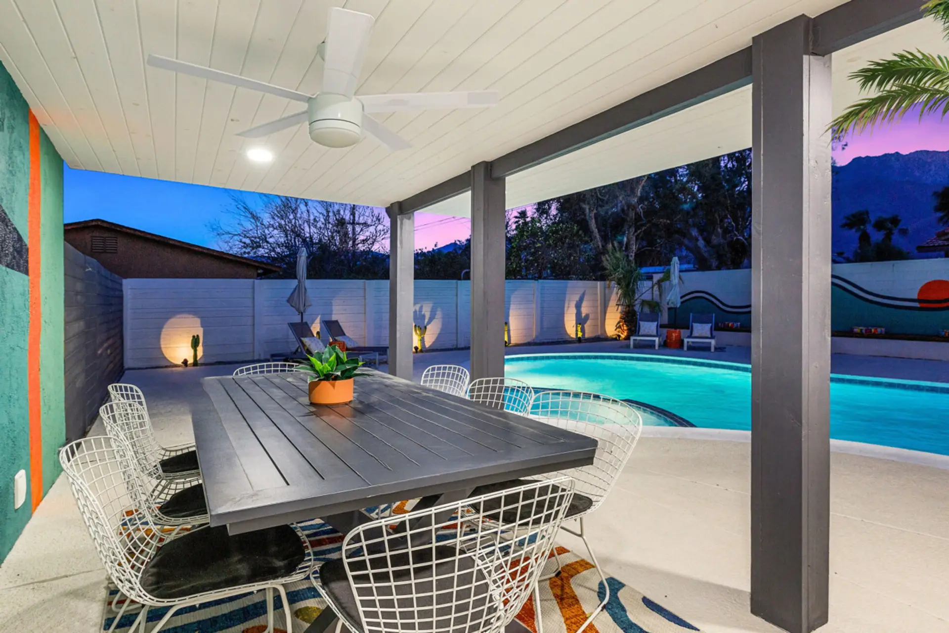 Covered patio w/ dining table offers a shaded spot to linger over meals & evening chats.