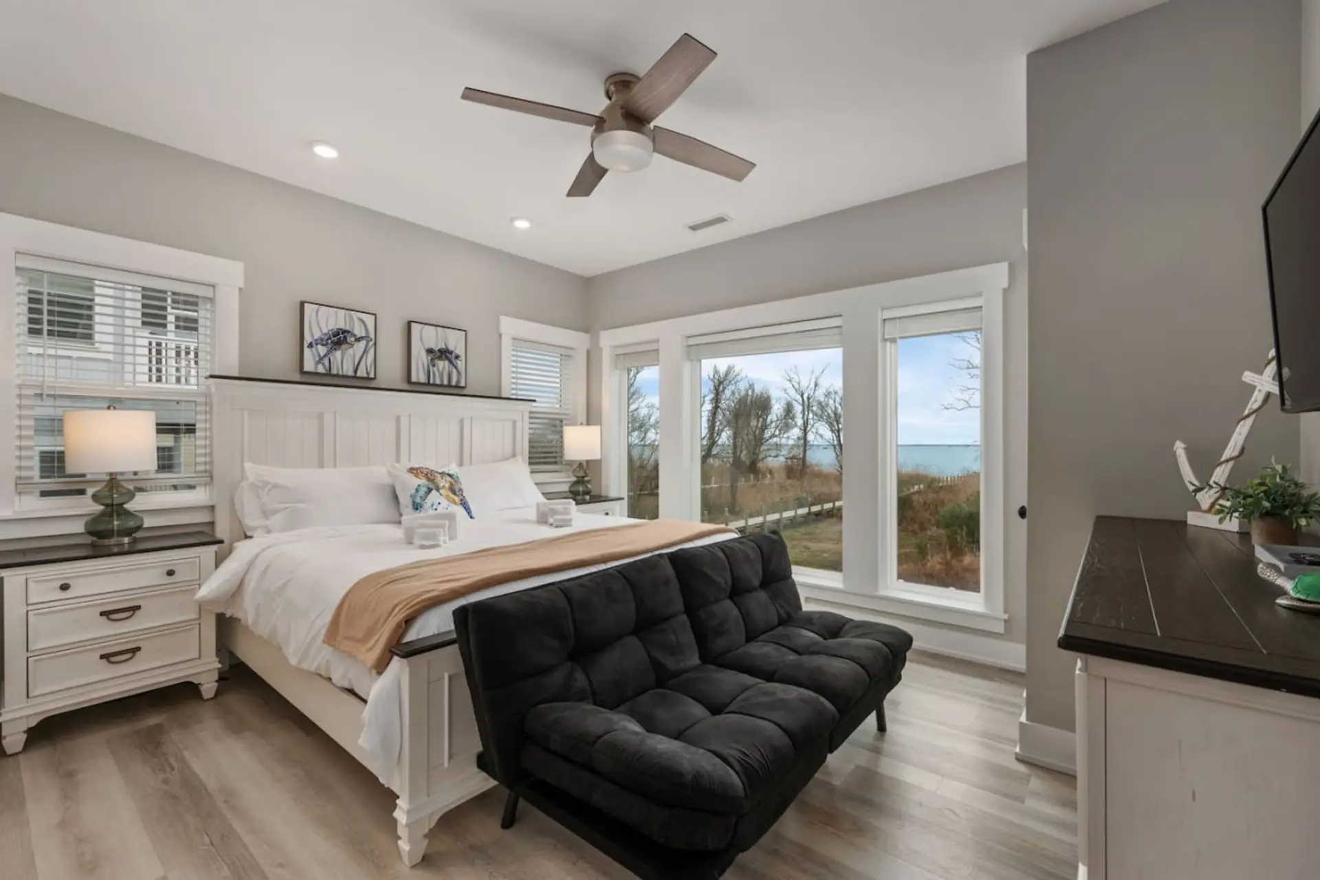 Serene bedroom retreat w/ soft tones, comfy bedding & a calm, airy feel.