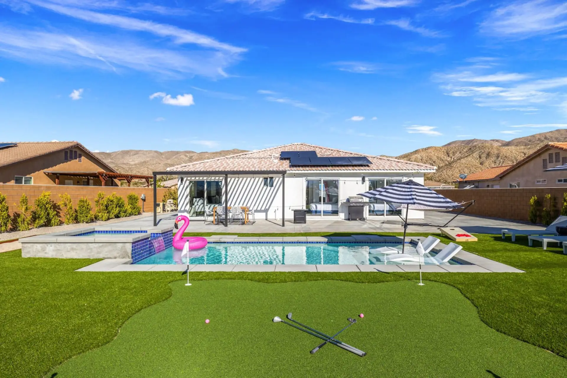 Spacious yard centered around the private pool, offering plenty of room to relax & unwind outdoors.