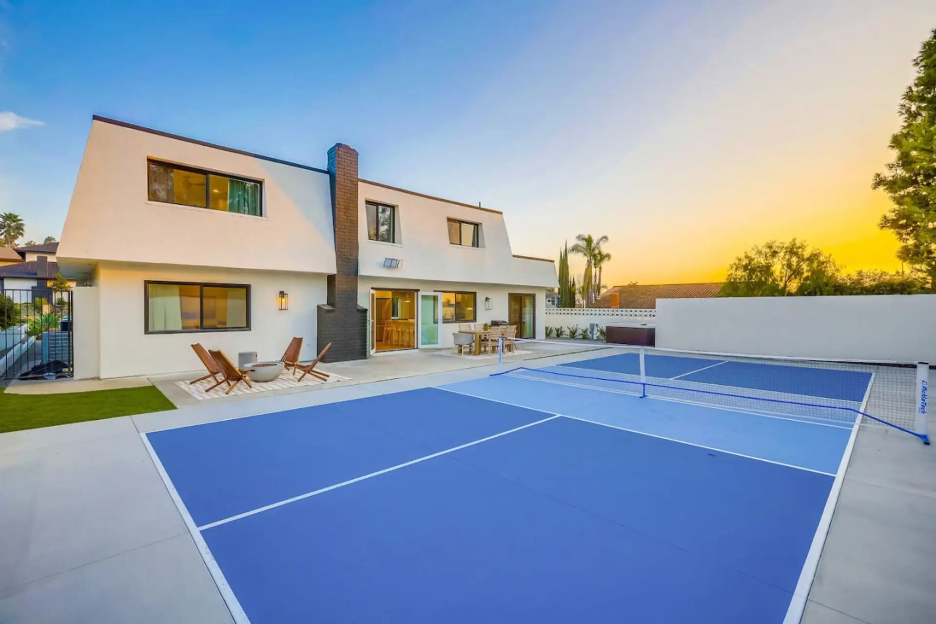 Private blue pickleball court w/ net & full lines, set right off the patio for sunset games.