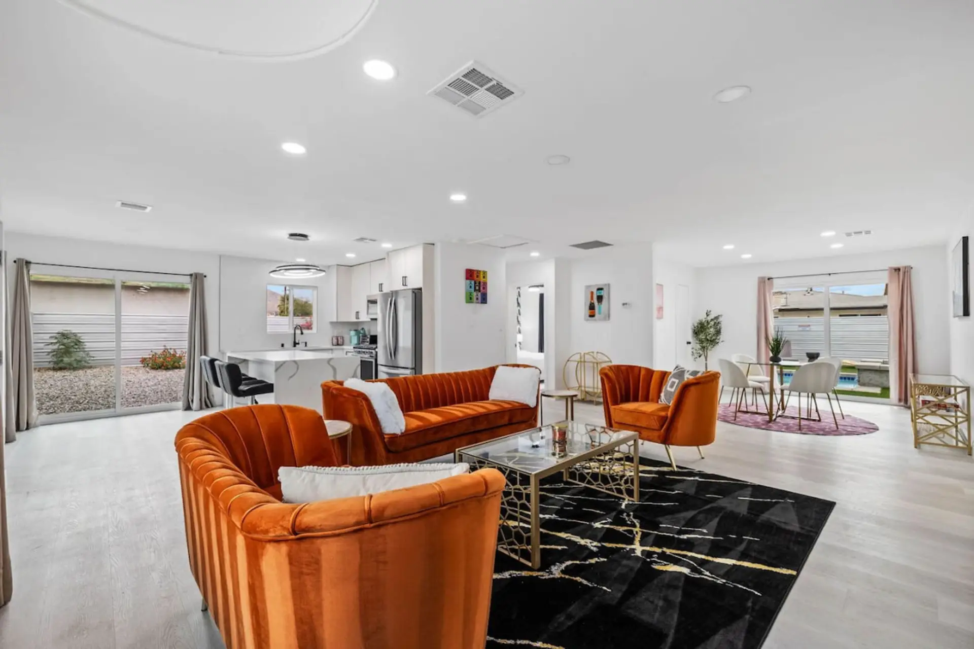Bright open living area w/ plush seating, modern finishes & an easy flow for relaxing or gathering together.