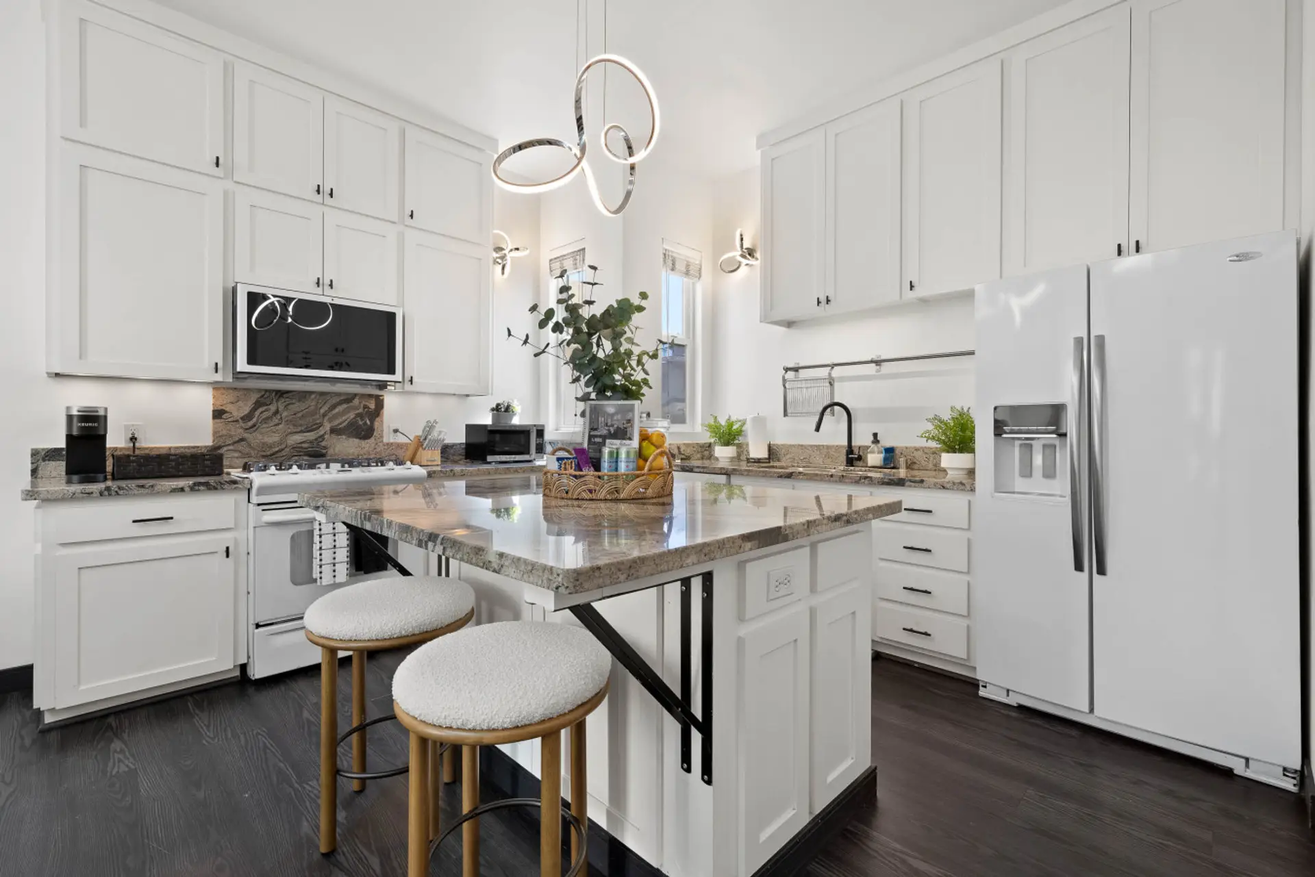 Modern kitchen w/ sleek cabinetry, ample counter space & everything needed to cook in.