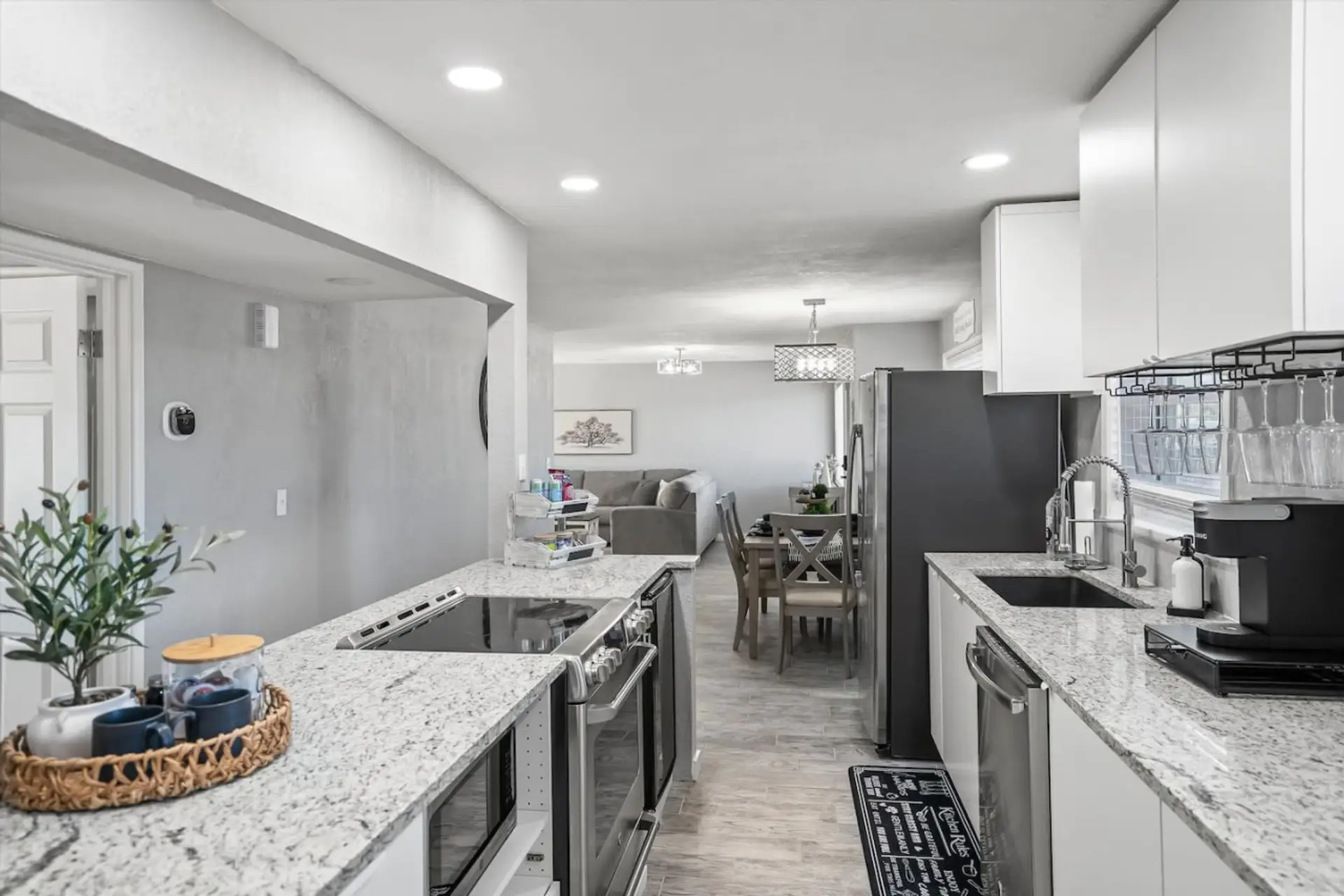 Sleek kitchen w/ stainless appliances, long counters & plenty of space to cook together.