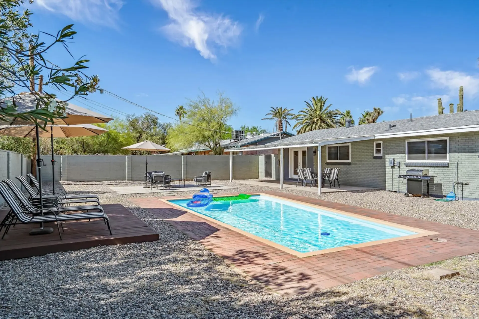 Private pool framed by desert landscaping, perfect for cooling off & soaking up the sun.