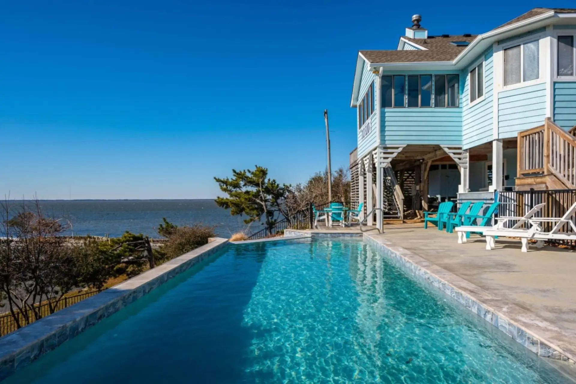 Infinity pool w/ sweeping sound views, perfect for cooling off as the water shimmers beyond.