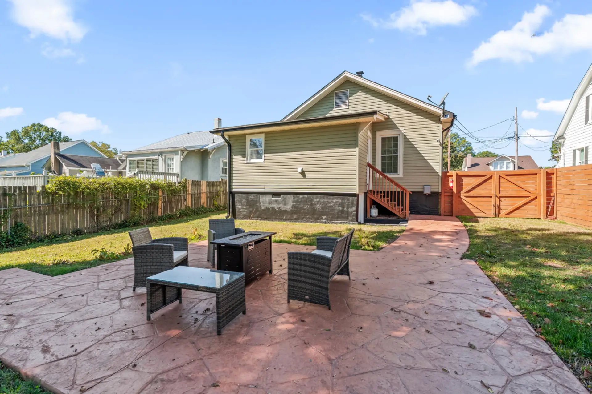 Private fenced backyard with firepit at Hygge High Point vacation rental in High Point North Carolina