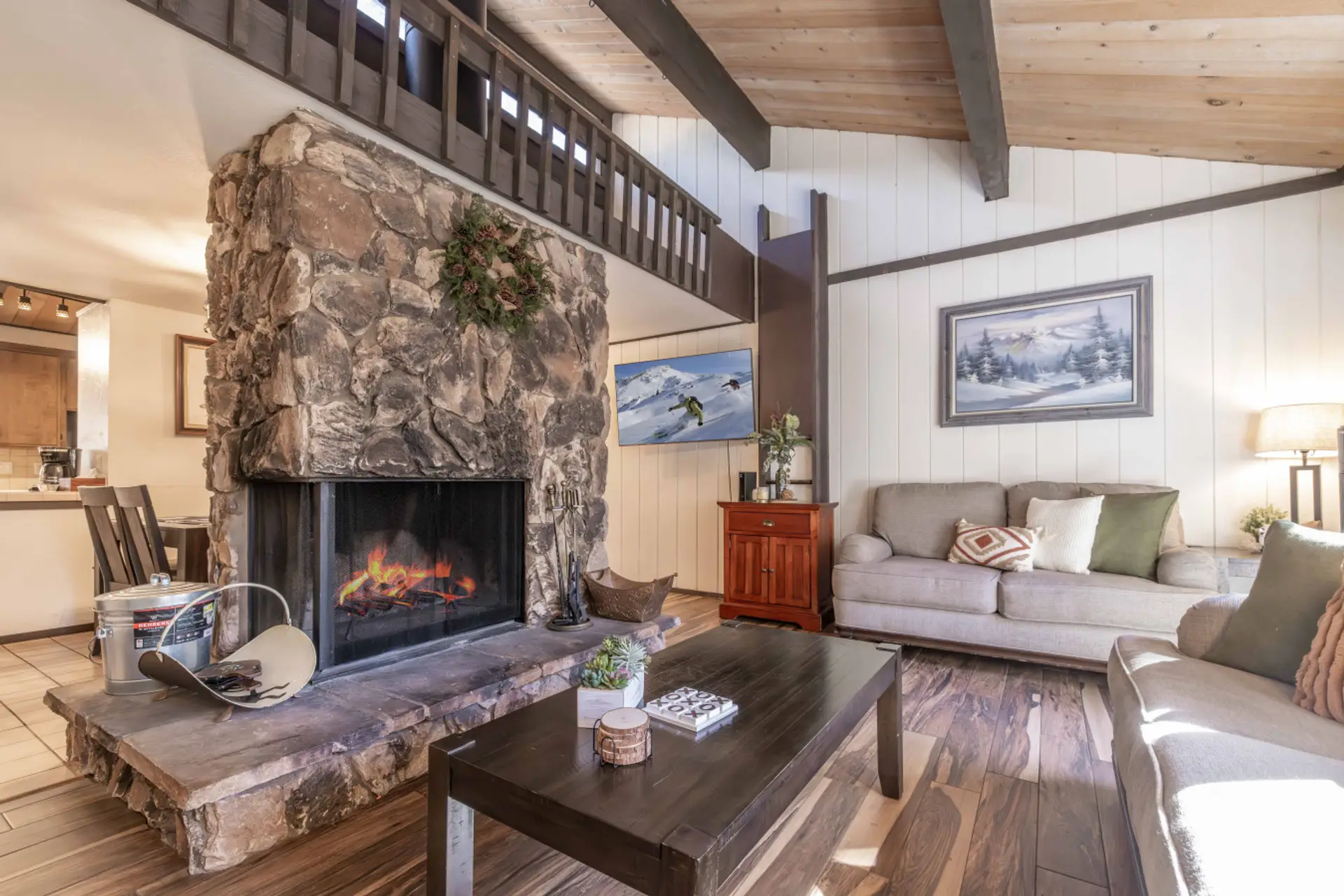 Living room with cozy fireplace and large TV