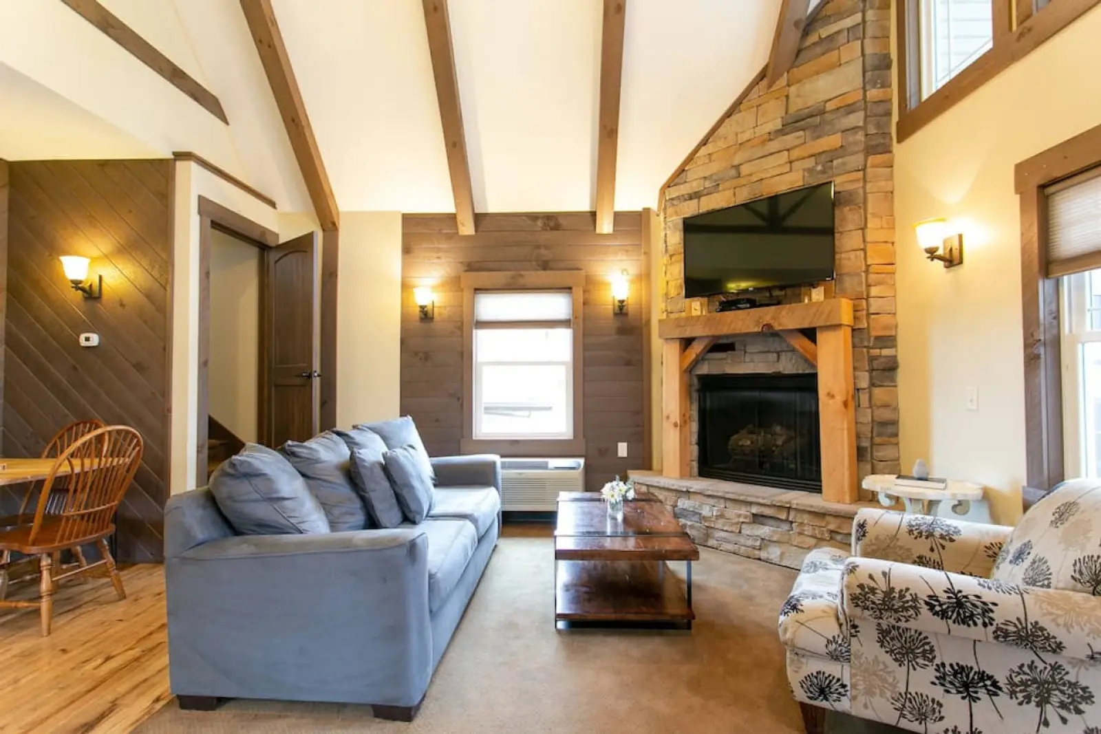 Berlin Cottages interior with fireplace and warm wood finishes