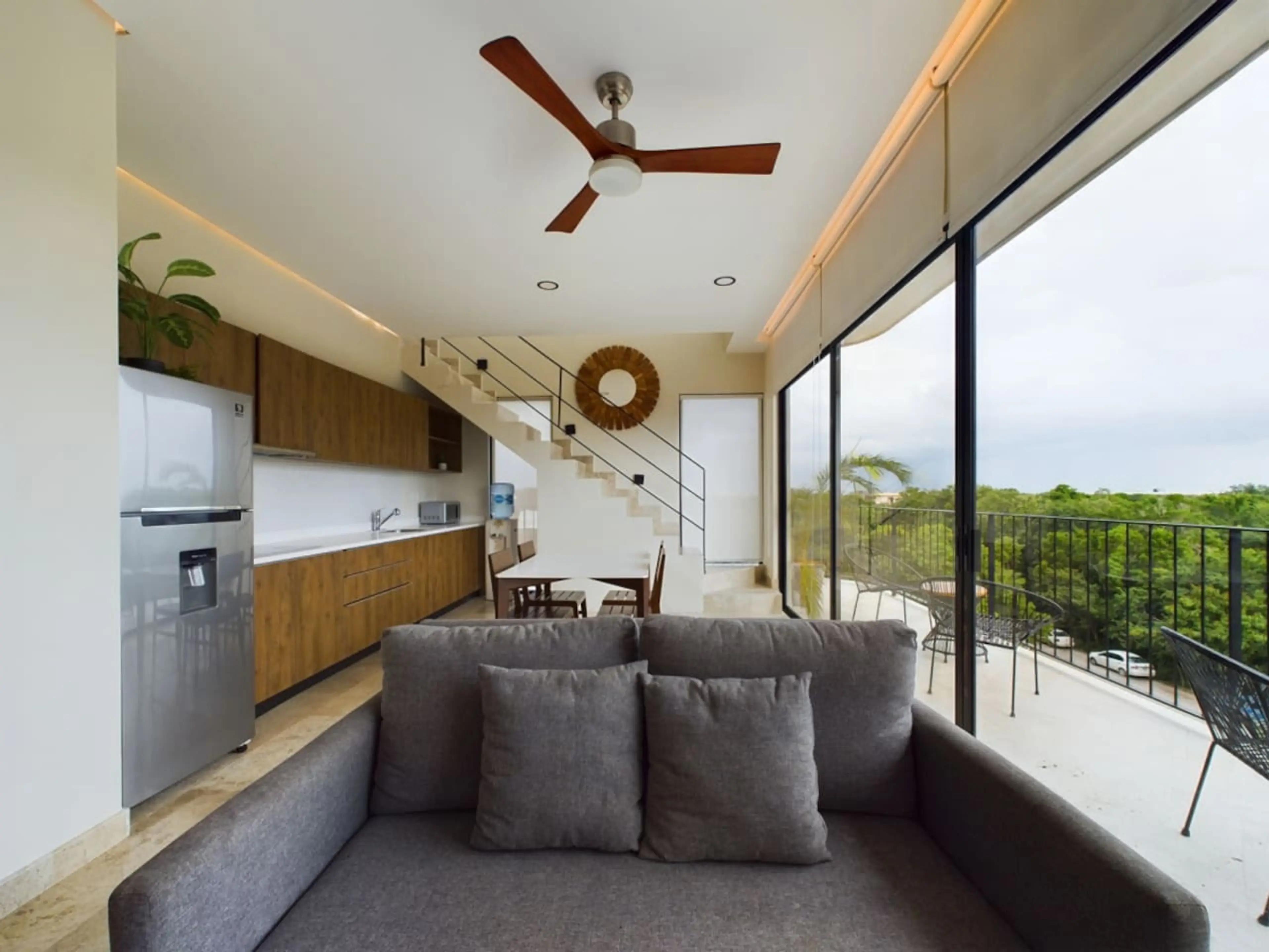 "Find the perfect place to unwind and recharge in our living room, complete with chic decor, cozy seating, and stunning sky views.