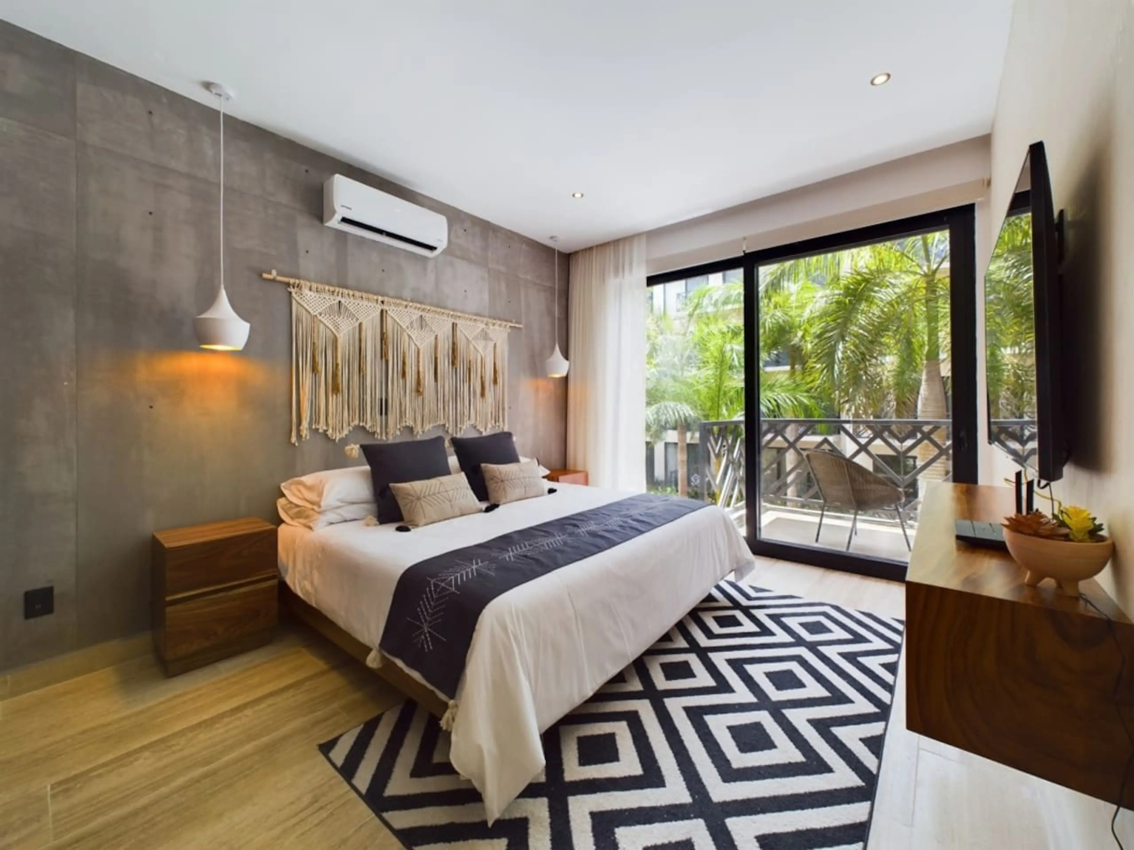 Enjoy the comfort of our thoughtfully designed room, featuring a king-size bed, Smart TV, and easy balcony access for a refreshing touch of luxury.