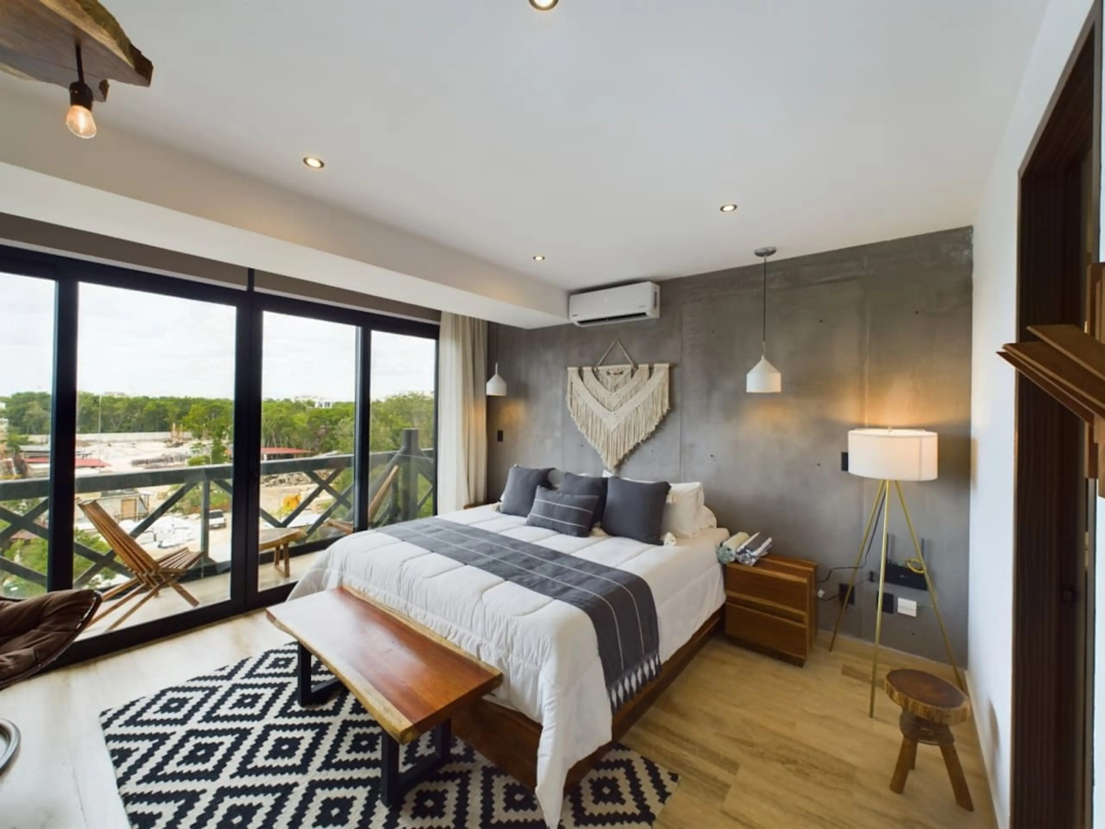 Indulge in this haven of comfort, a spacious king-size bed, stylish furniture complementing the décor, and abundant natural light through expansive windows create an inviting retreat.