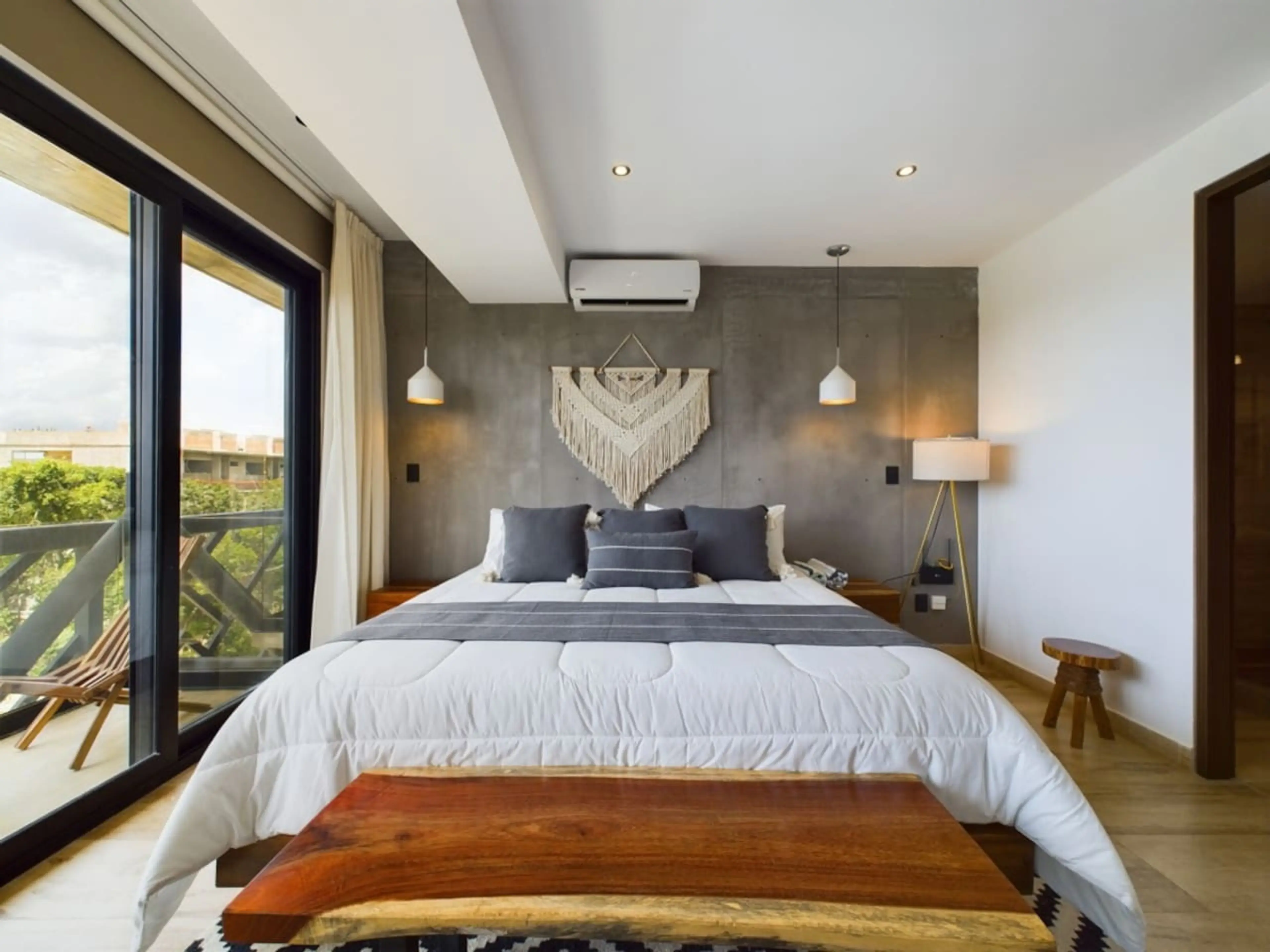 The bedroom boasts a supremely comfortable king-size bed adorned with high-quality linens—ensuring a restful and luxurious sleep experience.