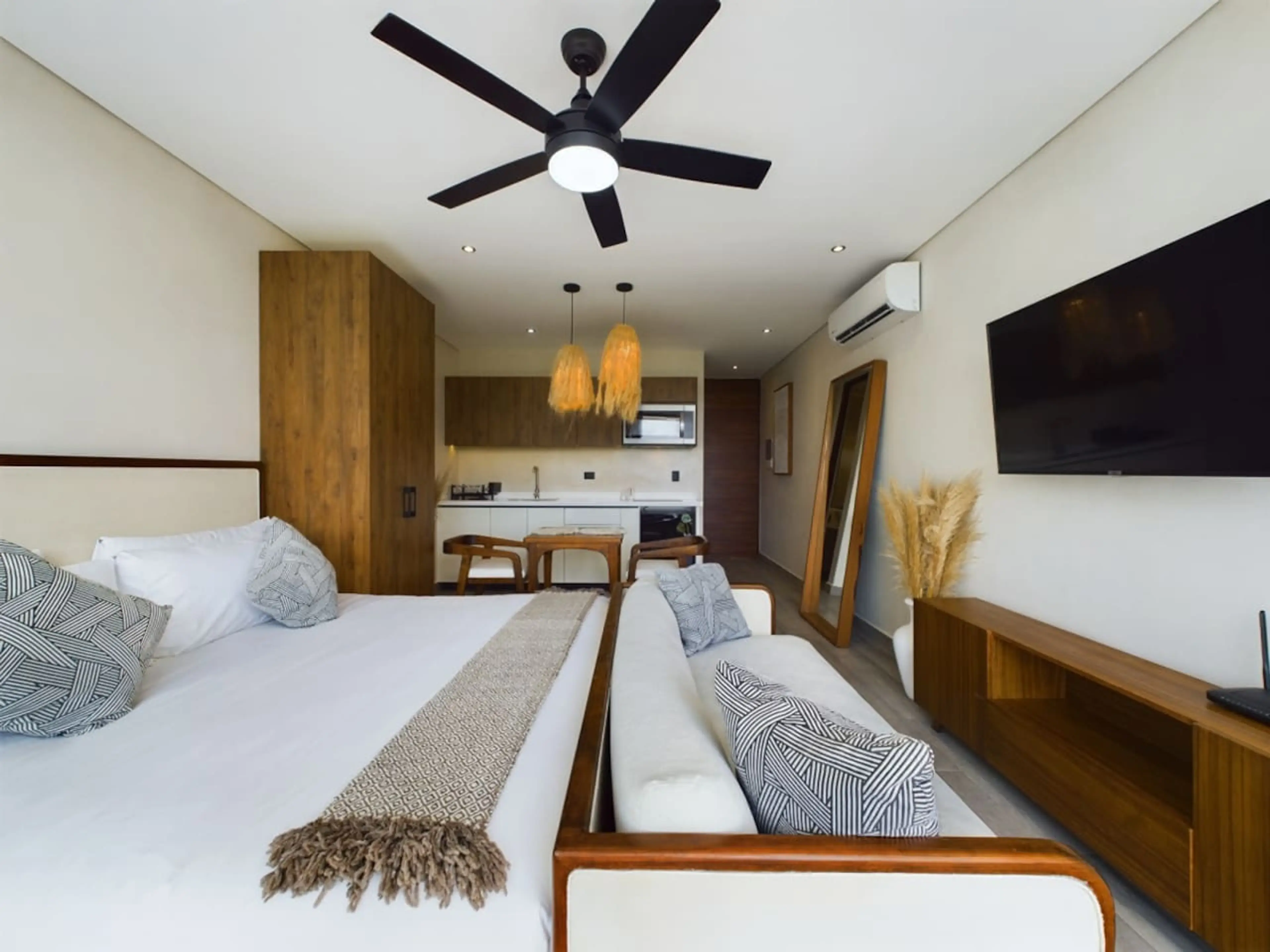 The living space features a brand-new, ultra-comfortable king-size bed, along with a large Smart TV loaded with all your favorite apps