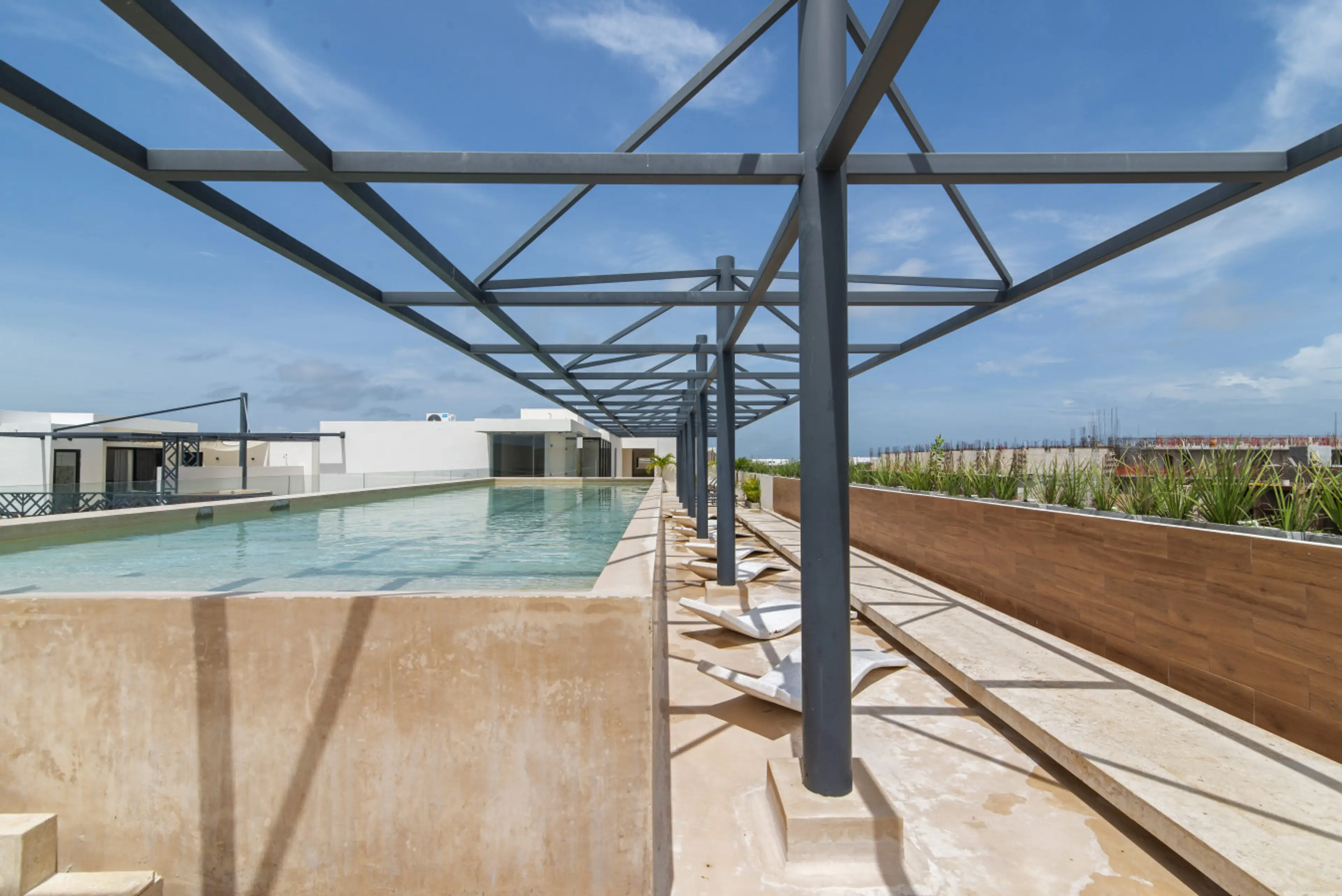 Escape to our tranquil pool, the perfect retreat with cozy spots for total relaxation.          Preguntar a ChatGPT
