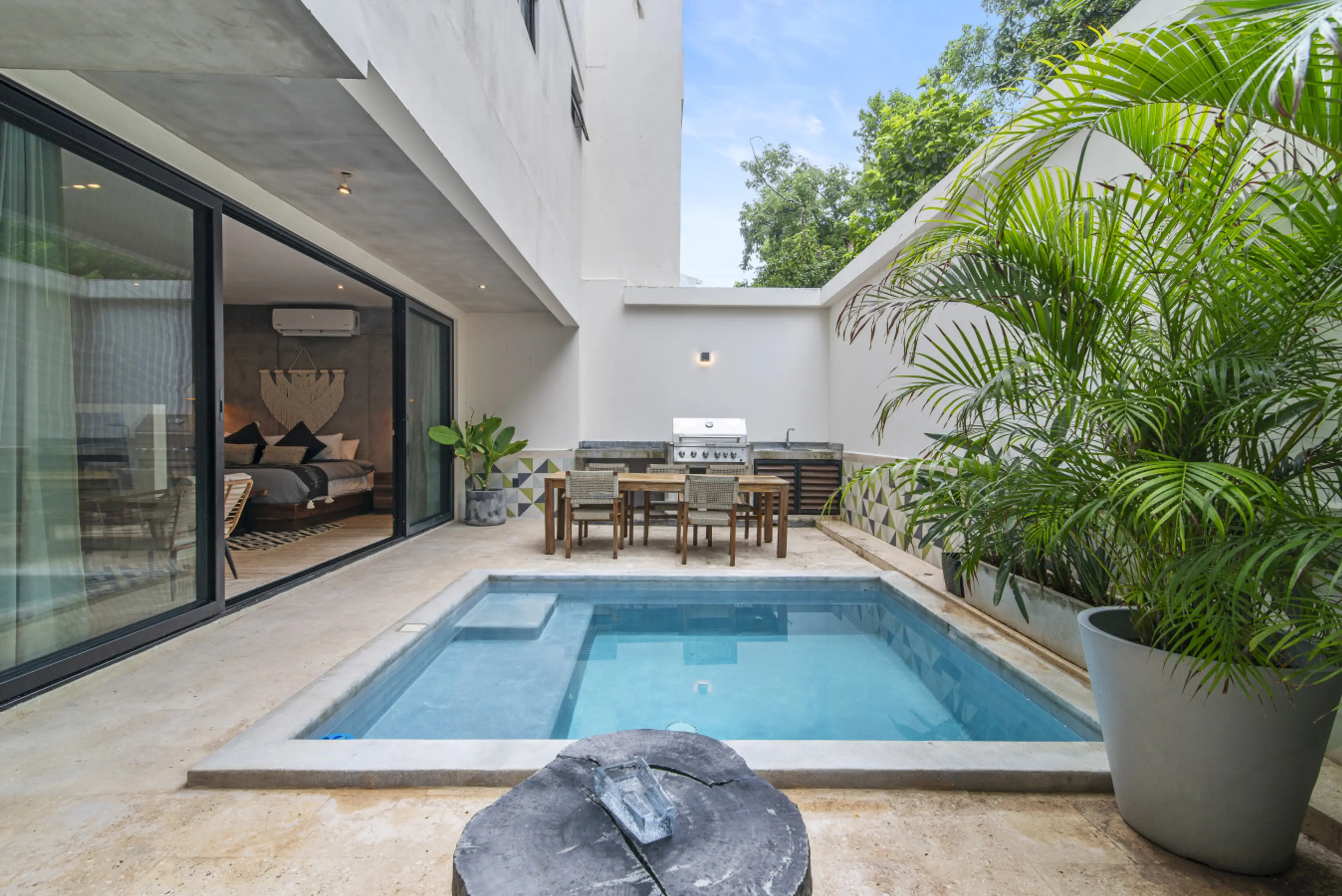 Relax in your own Tulum paradise with a pool, grill, and lush plants—ideal for sun-soaked afternoons.
