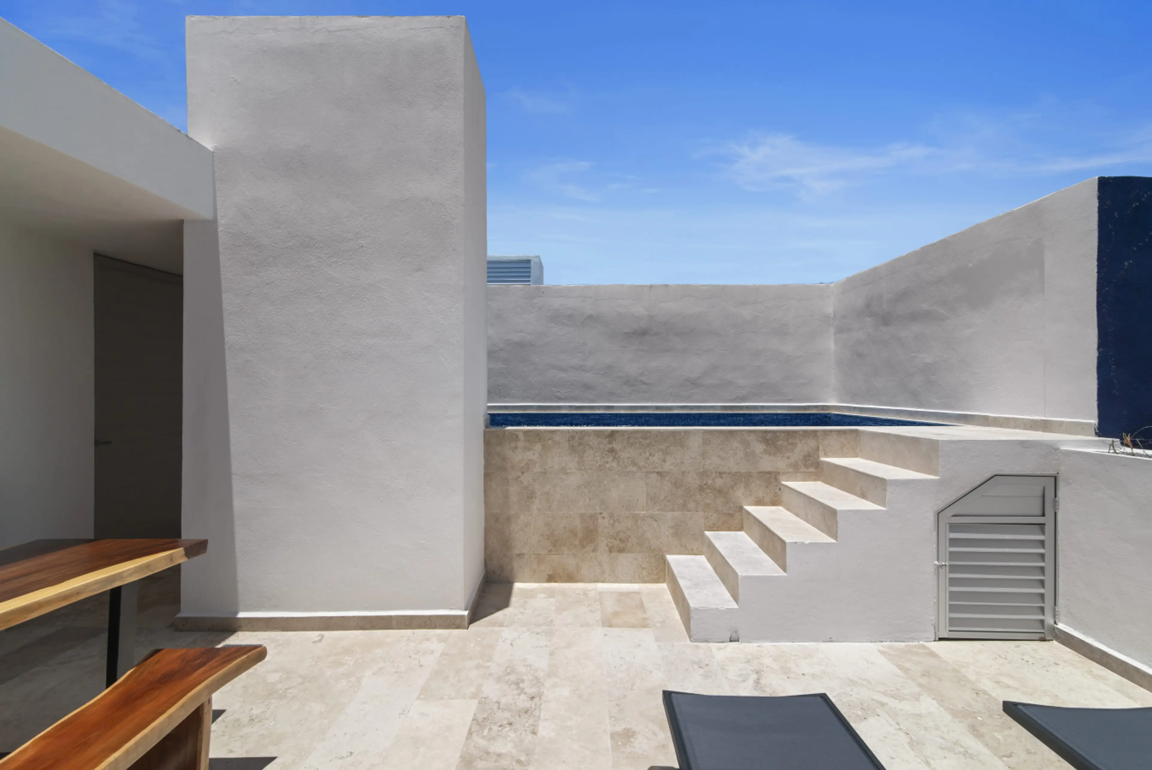 Dine, relax, or sip cocktails in this sleek rooftop setting with a casual bar and sunny loungers.