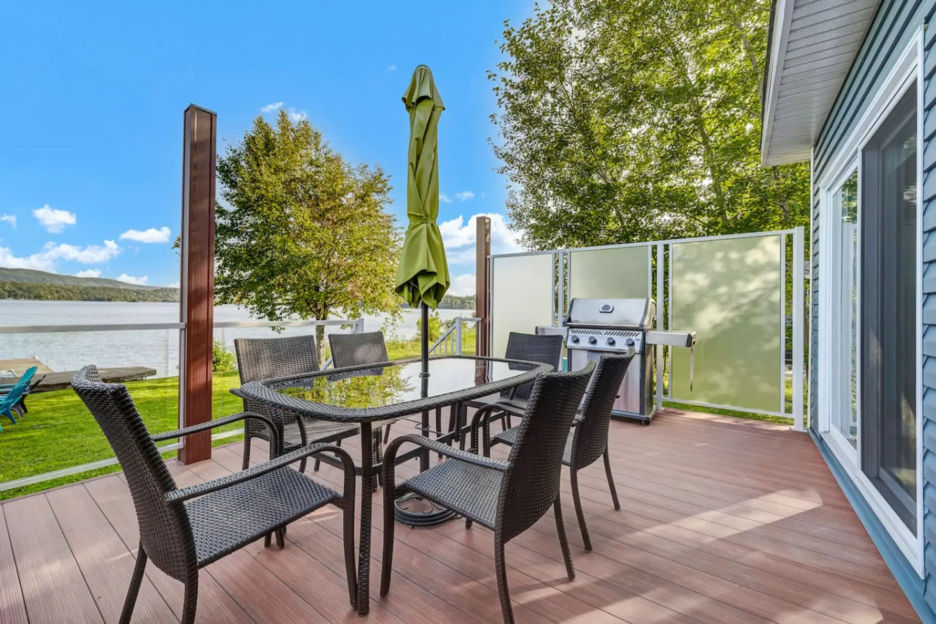 Enjoy meals on the spacious lakeside deck overlooking the water and surrounding mountains.