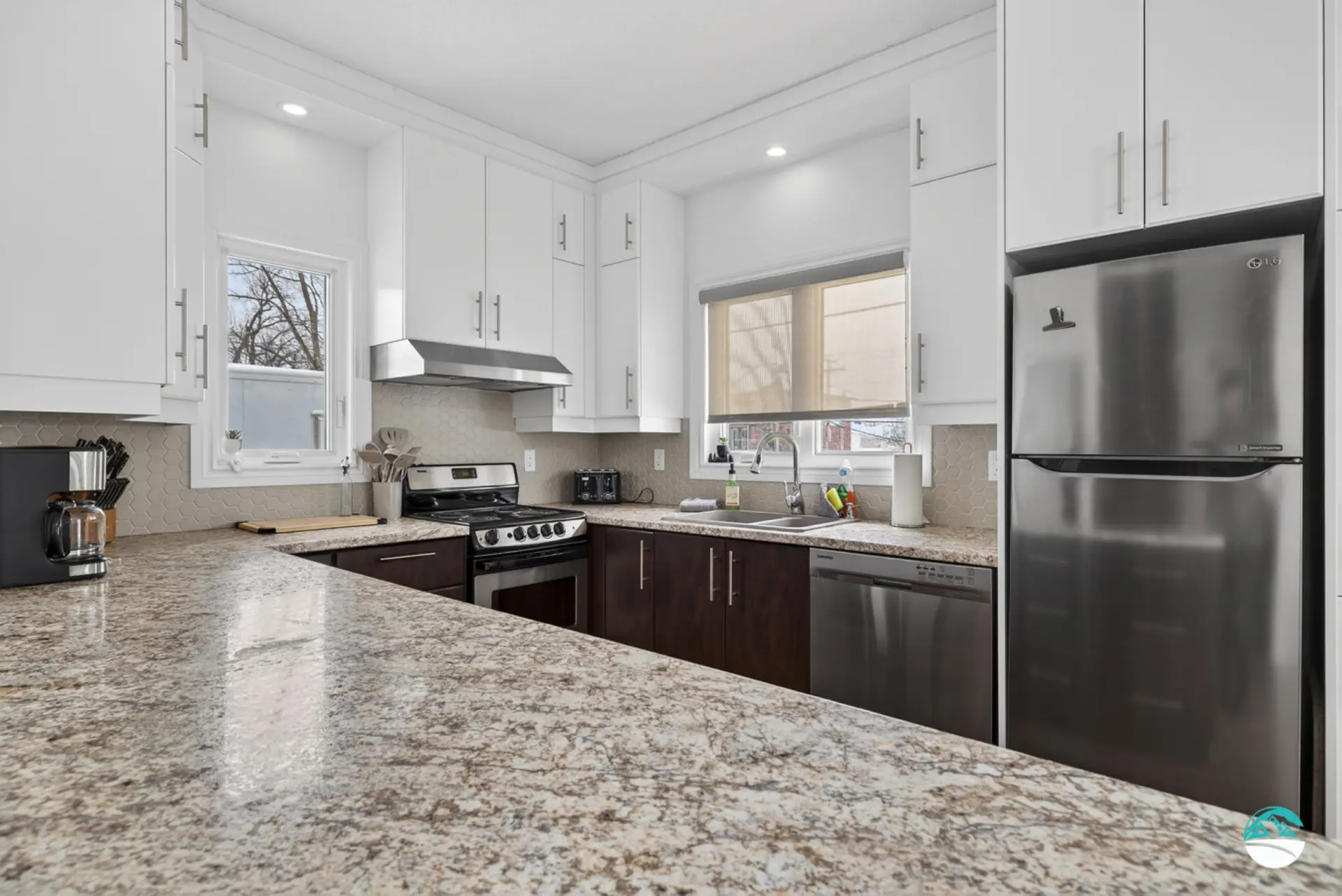Complete kitchen with two windows
