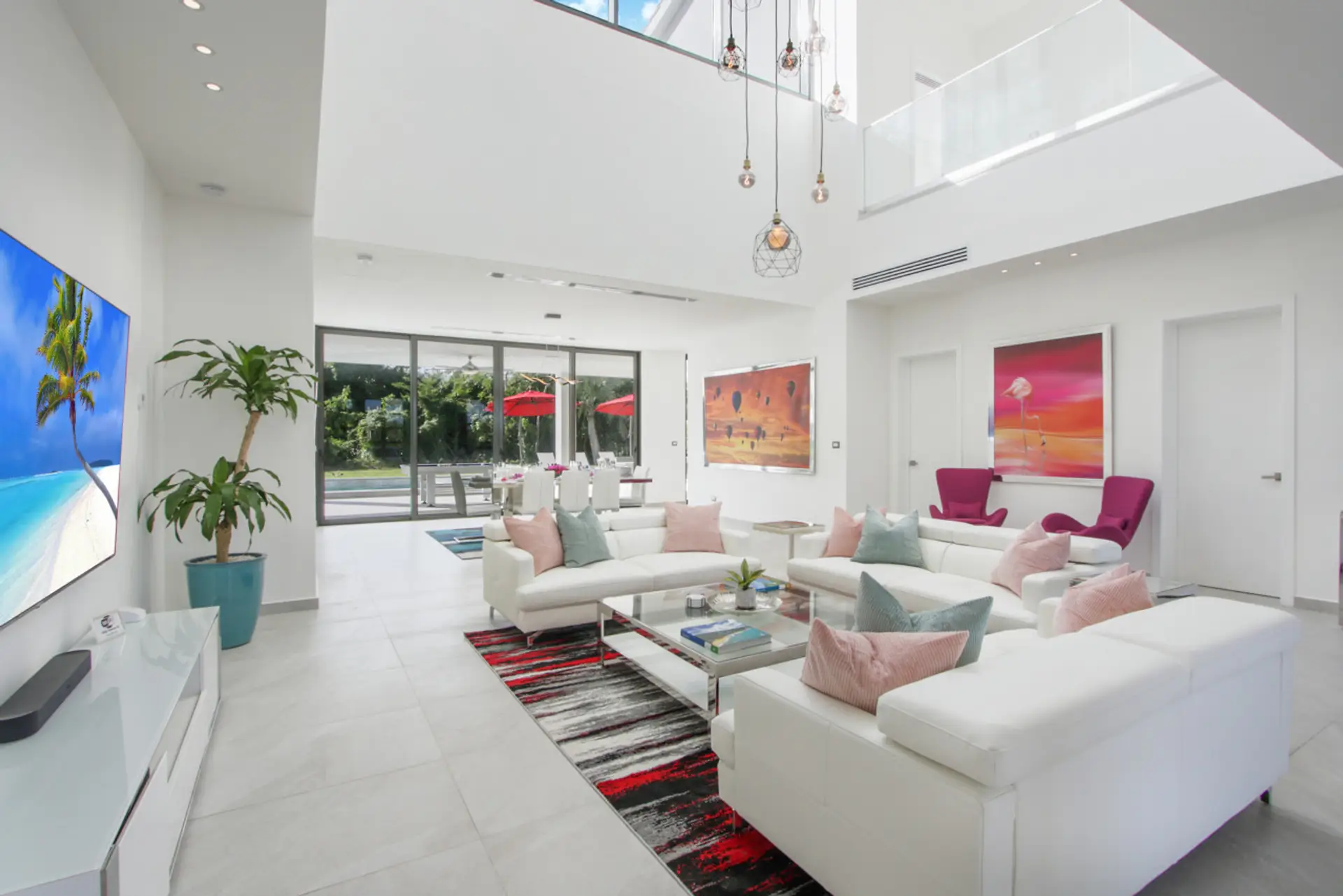 Living room with sofas and 86" smart tv. All pictures are actual pictures NOT renderings!