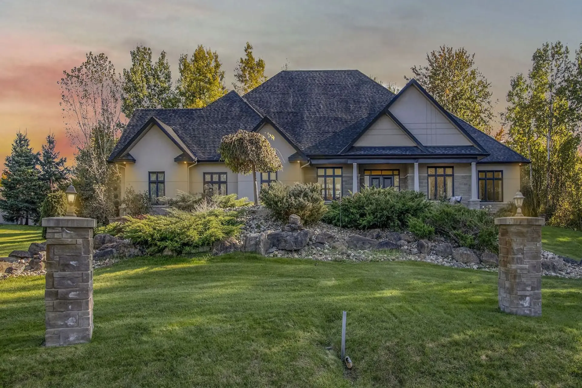 Front exterior of the Manotick estate at dusk