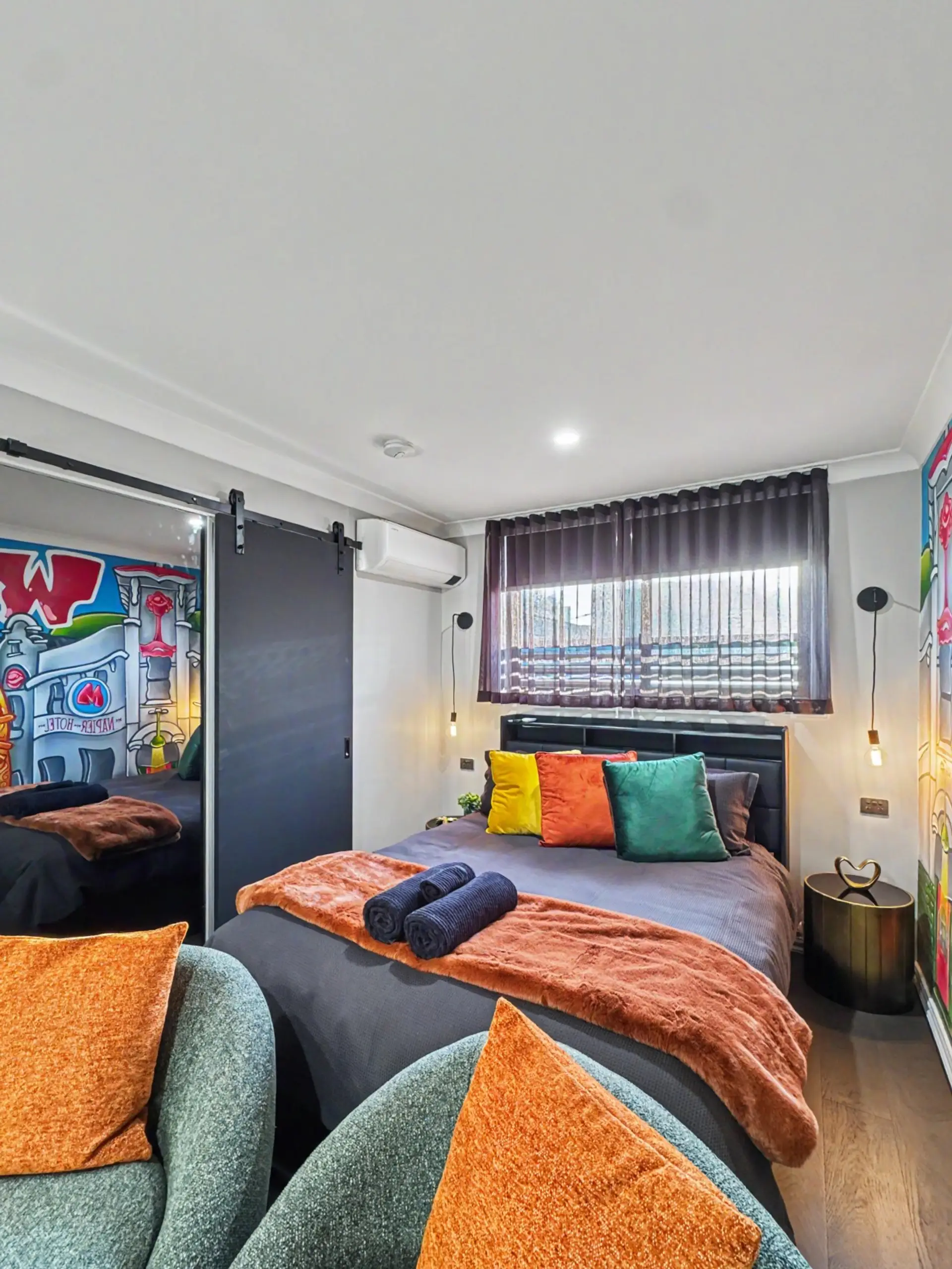 Settle into the queen bed with air conditioning, warm lighting and the bathroom conveniently located nearby