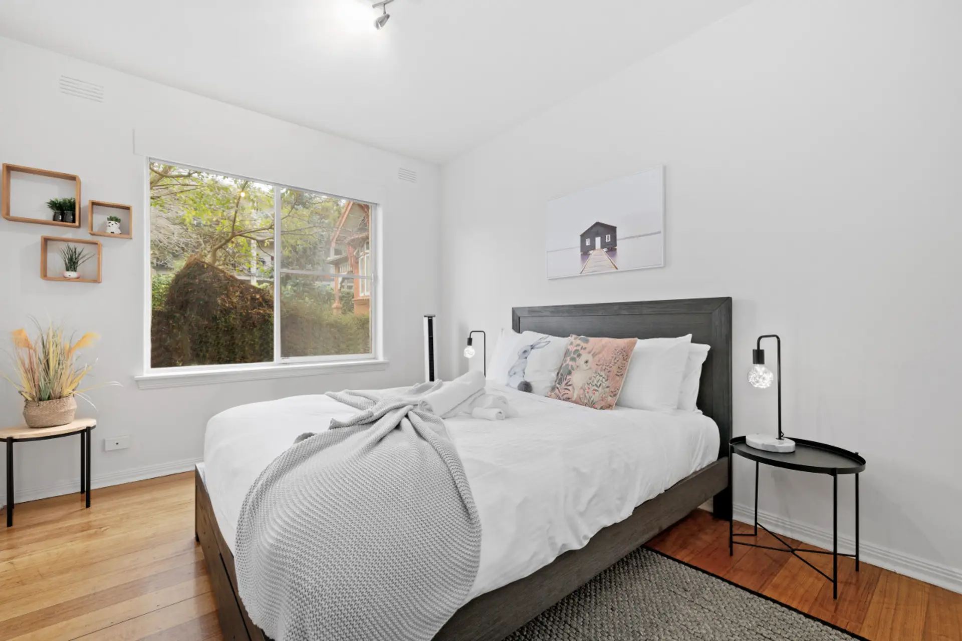 Bedroom with comfy queen size bed and fluffy pillows