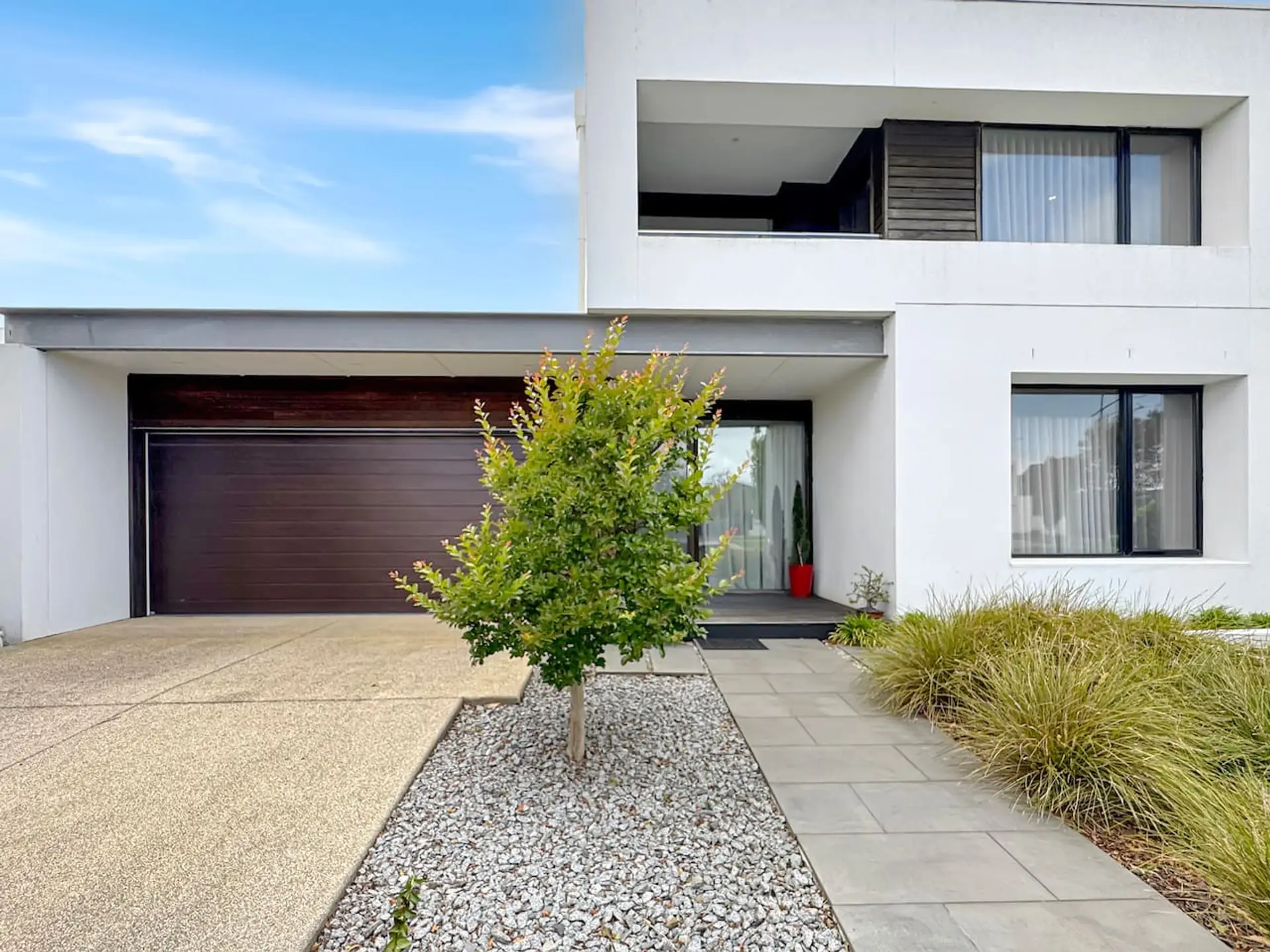 A beautifully landscaped pathway guiding you to a striking modern home with strong street appeal and elegant design.