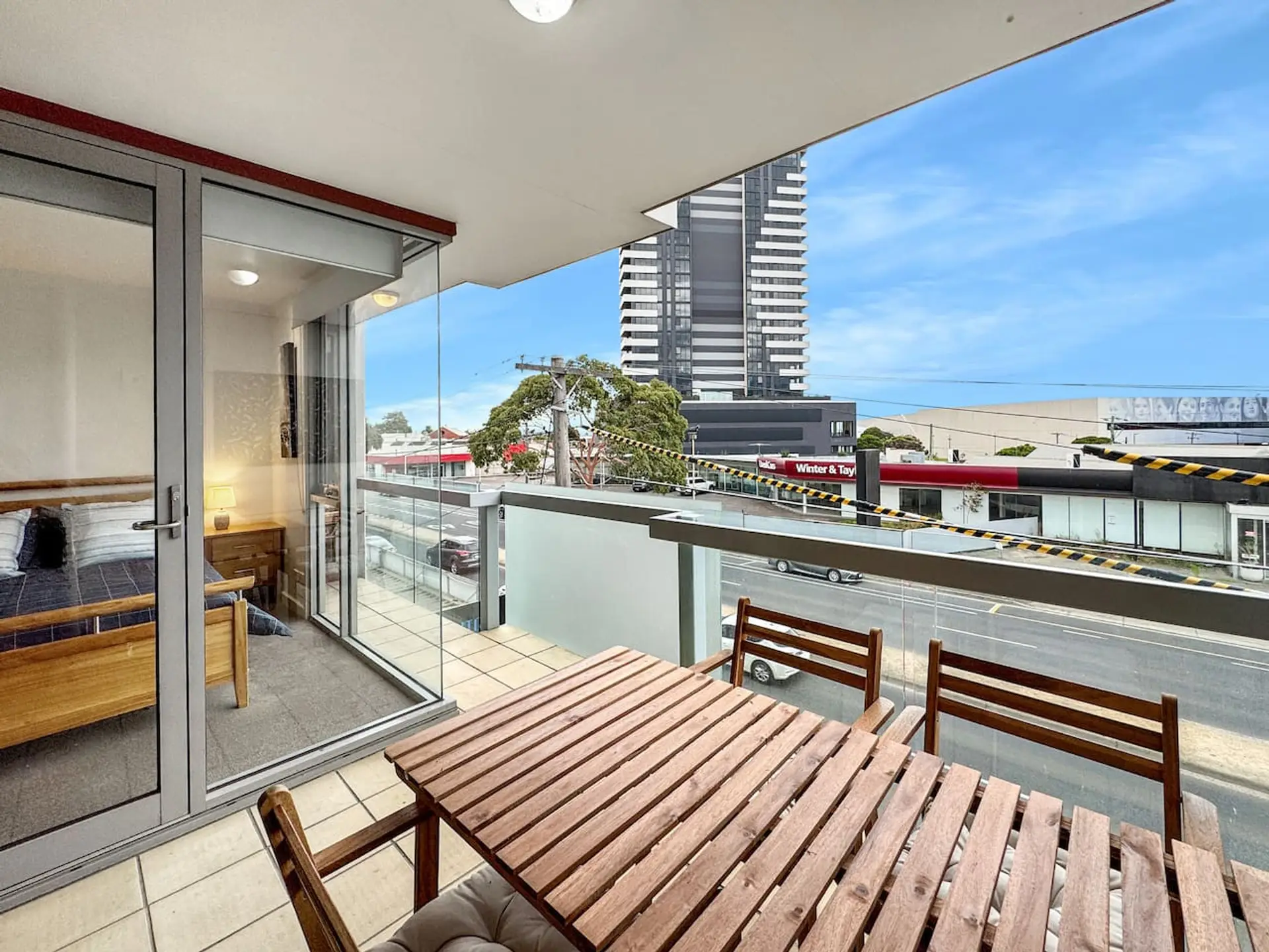 Private balcony with outdoor dining perfect for morning coffee before heading to the waterfront