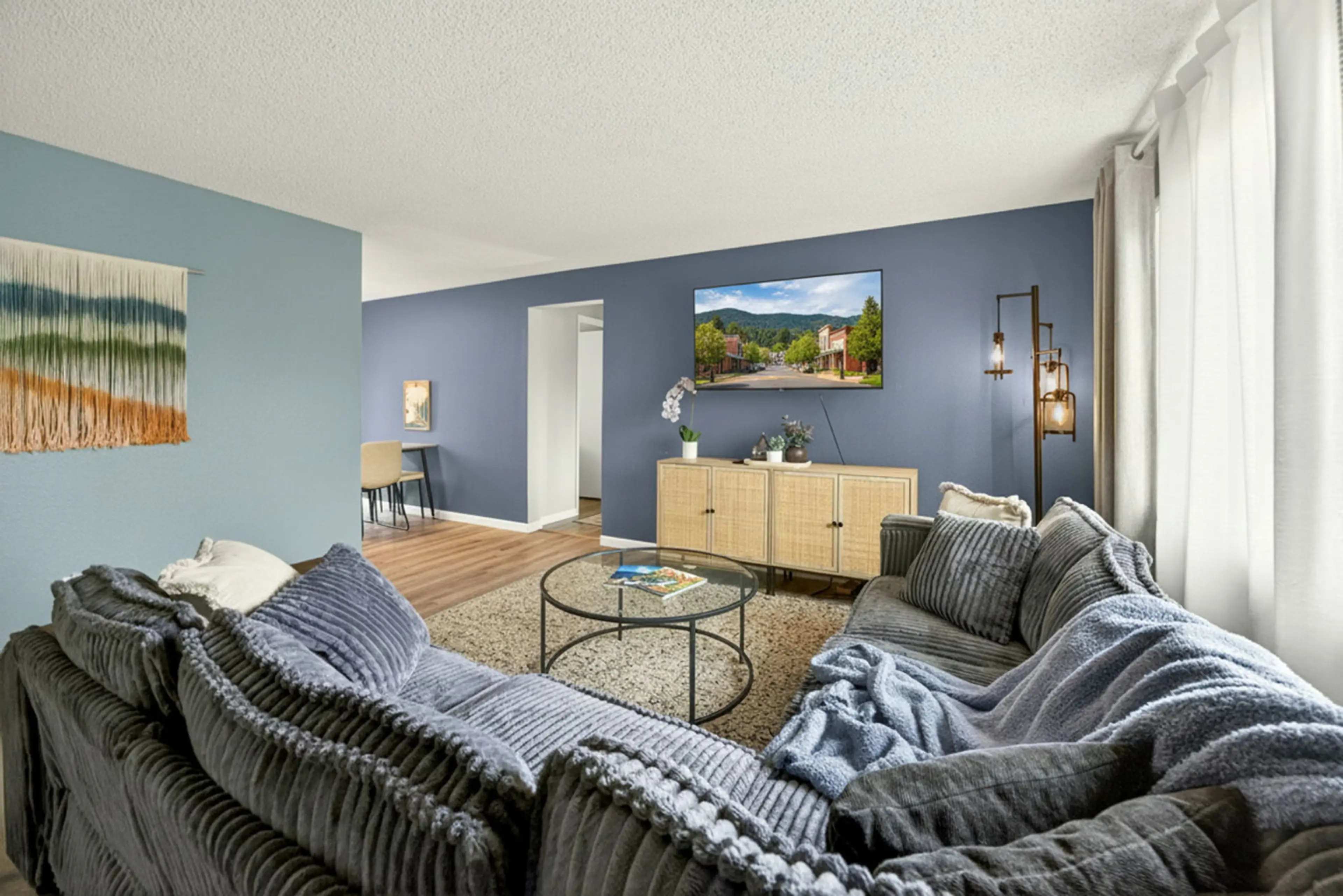 Large living room with new couch and SMART TV