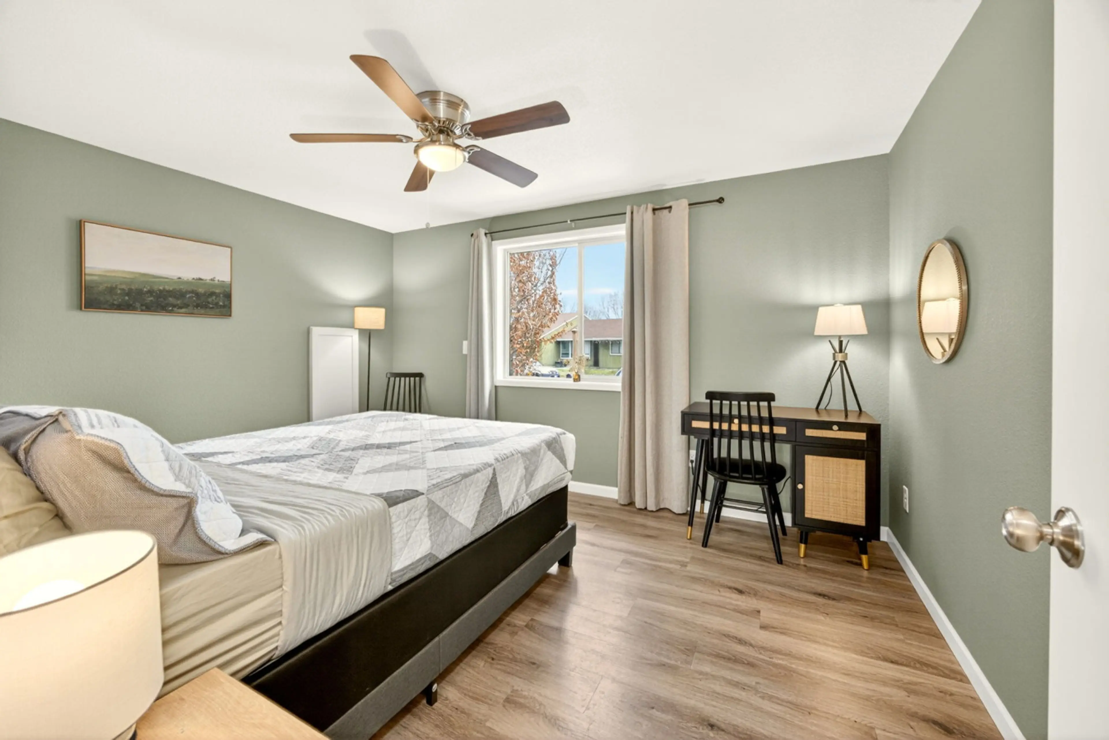 Spacious queen room with dedicated workspace