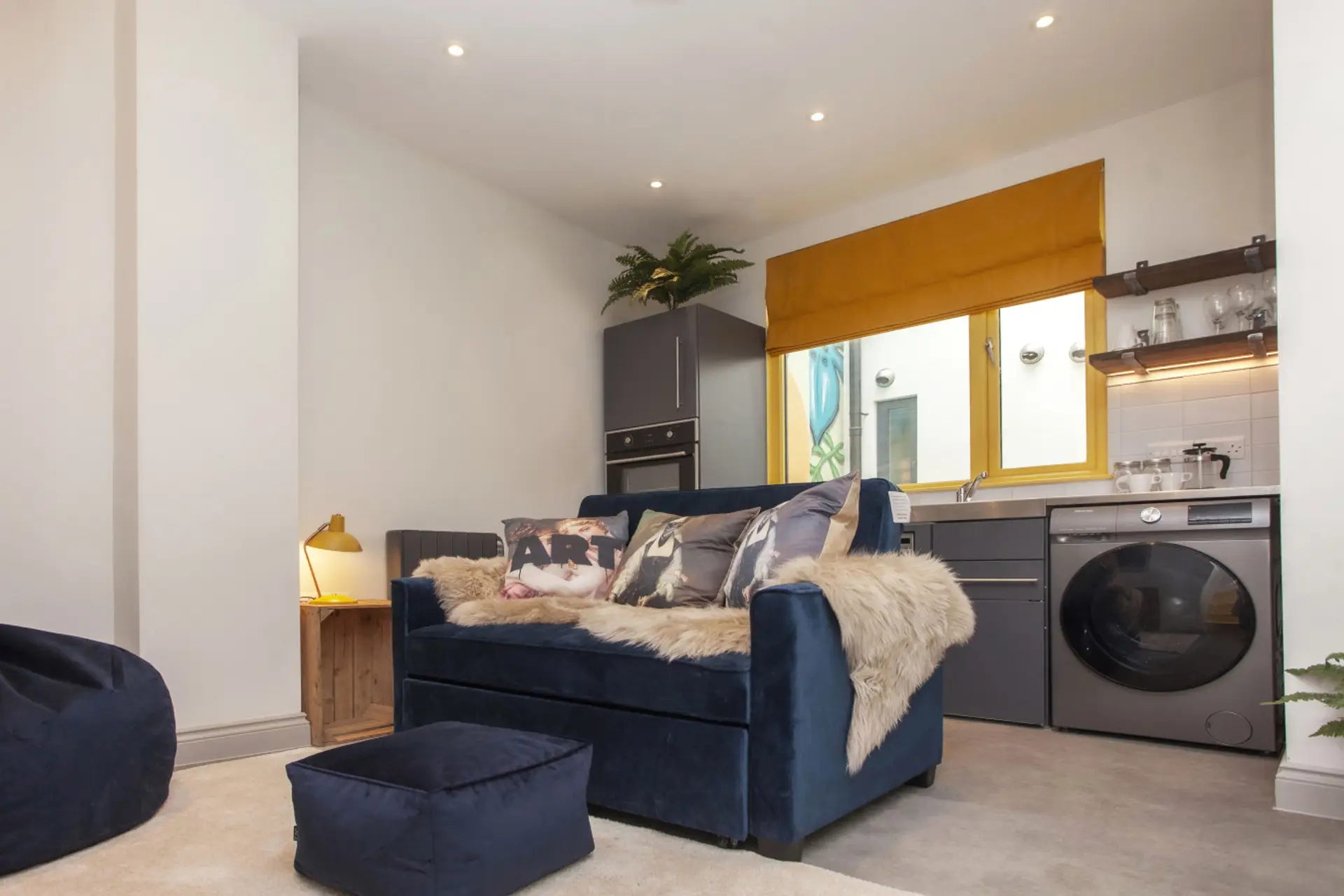 Stylish city-centre studio with cozy sofa, Smart TV, and modern kitchen.