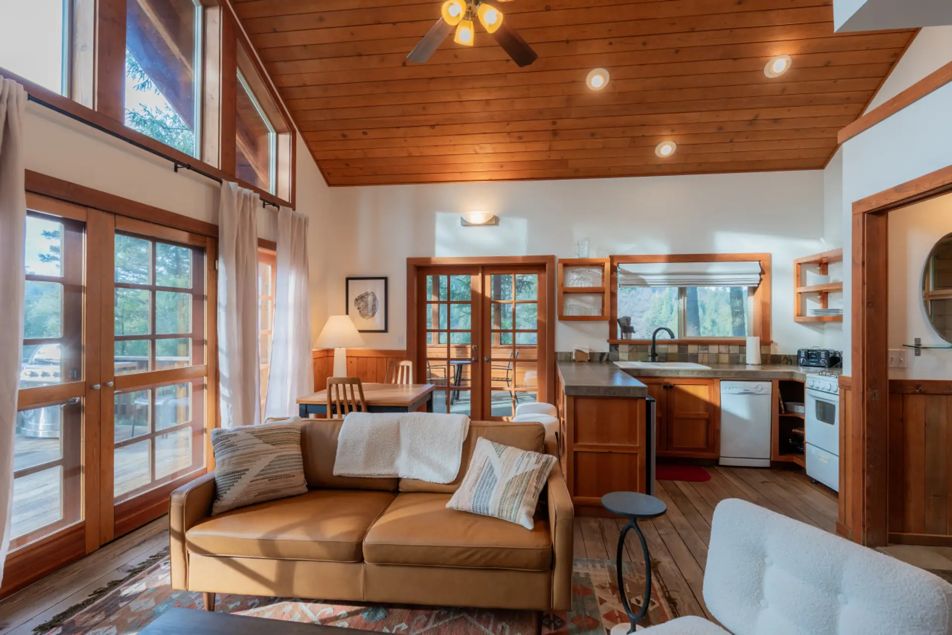 Cozy Living Room with Leather Couch and Fully Stocked Kitchen