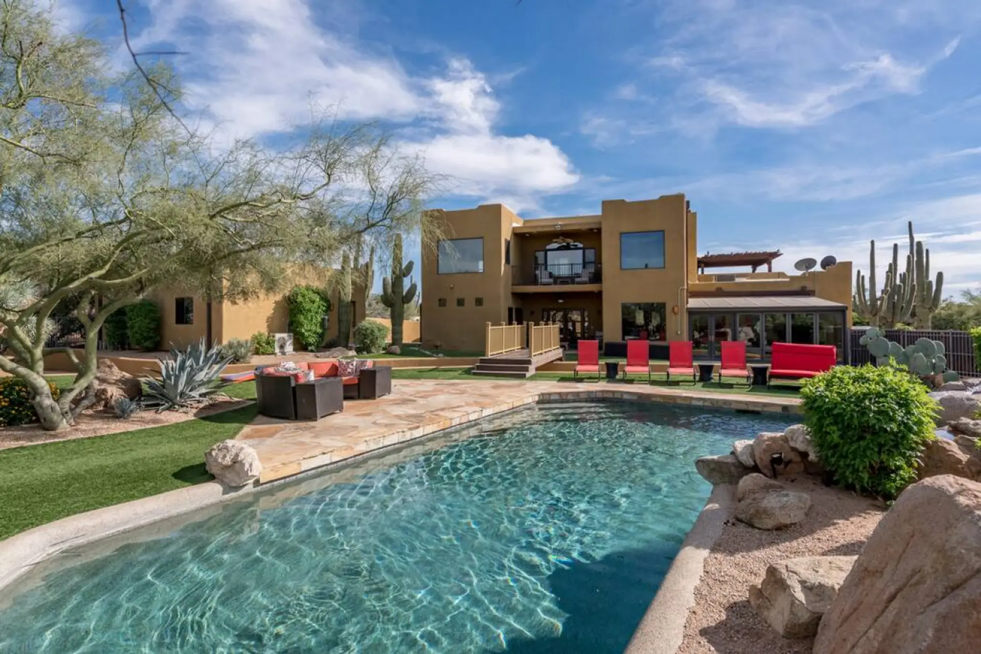 [Resort Property] Heated Saltwater pool with state-of-the-art Pebble Tec and waterfalls, with plenty of lounging