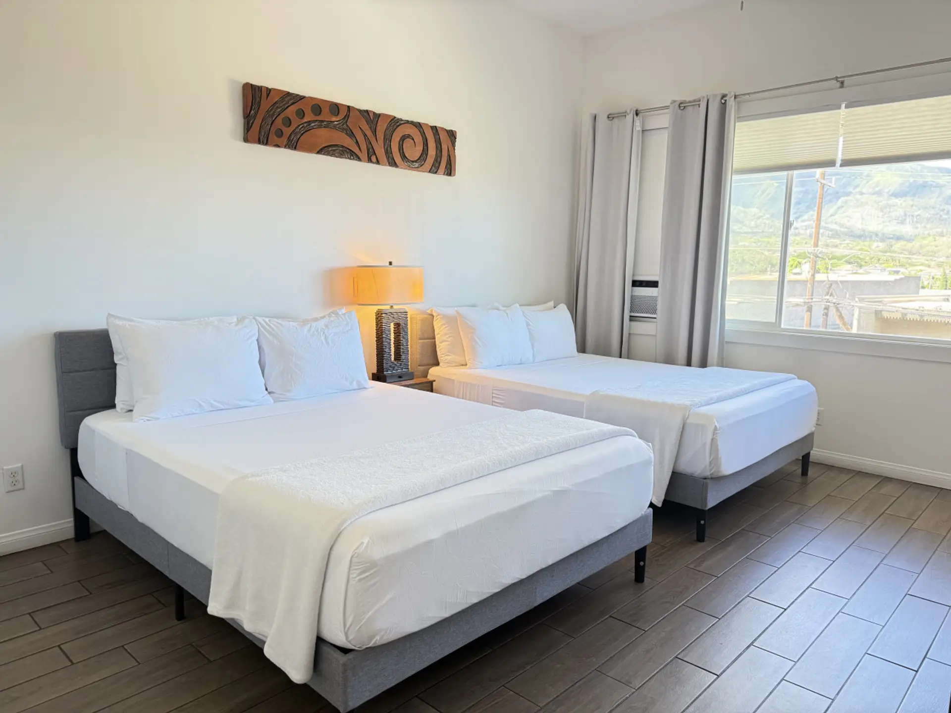 Two queen beds with cooling, medium-firm mattresses—designed for comfort, support, and restful sleep