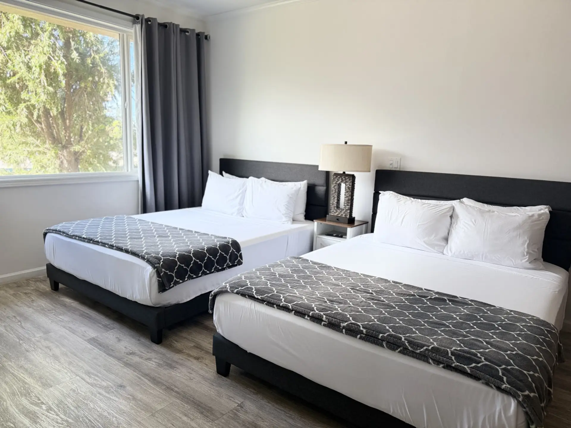 Two queen beds with cooling, medium-firm mattresses—designed for comfort, support, and restful sleep