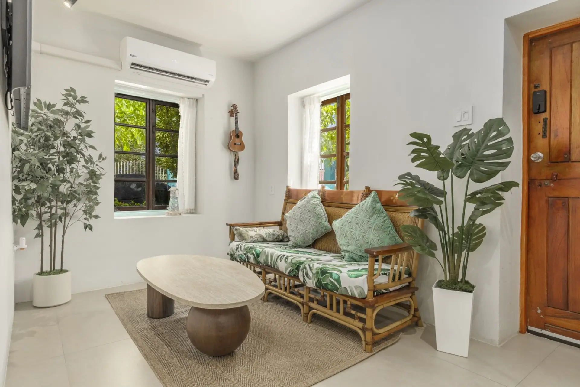 Start your day in a sun-kissed living room surrounded by lush greenery