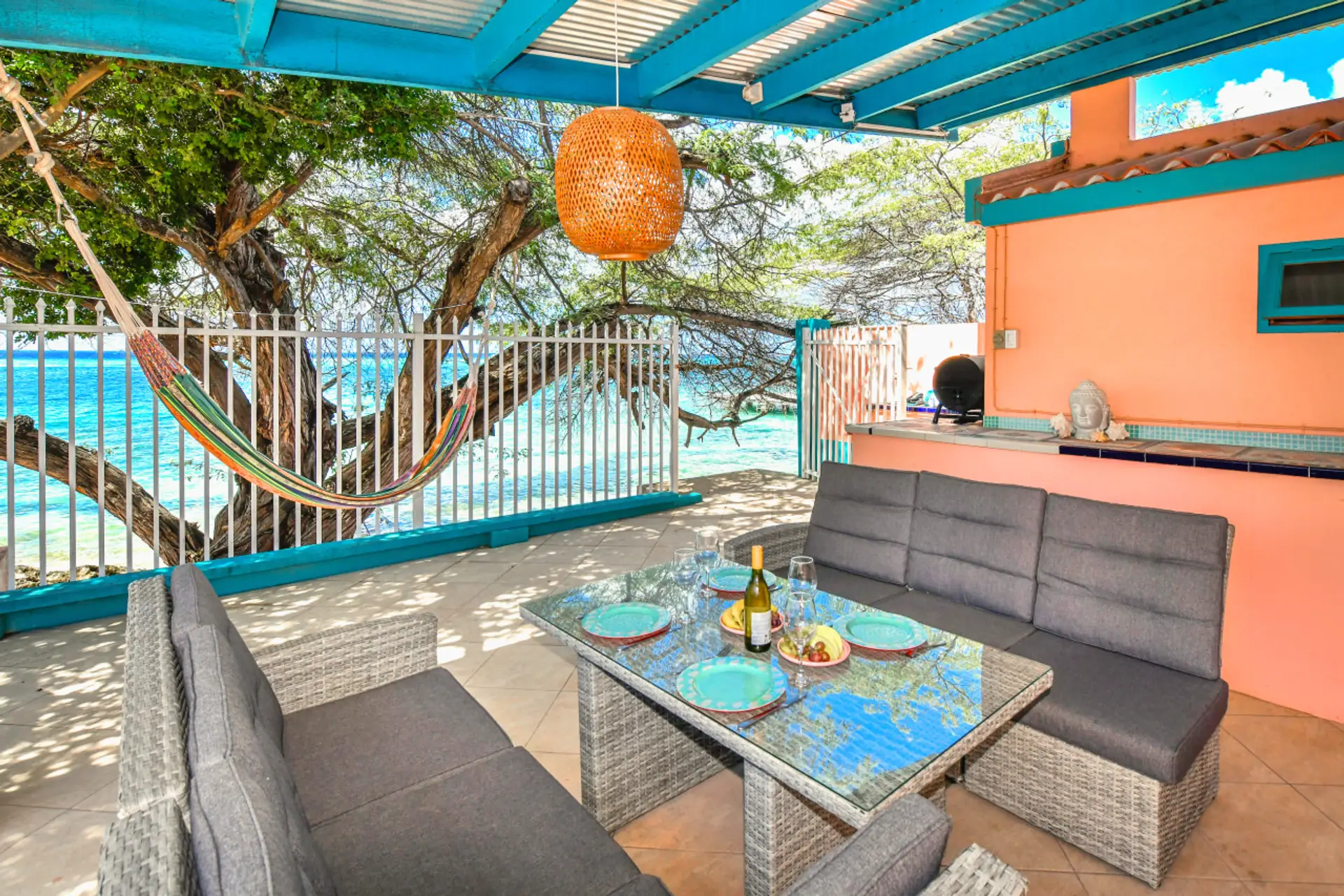 Indulge in breakfast, lunch, or dinner on your private porch, complete with a charming dining table and a delightful ocean view.