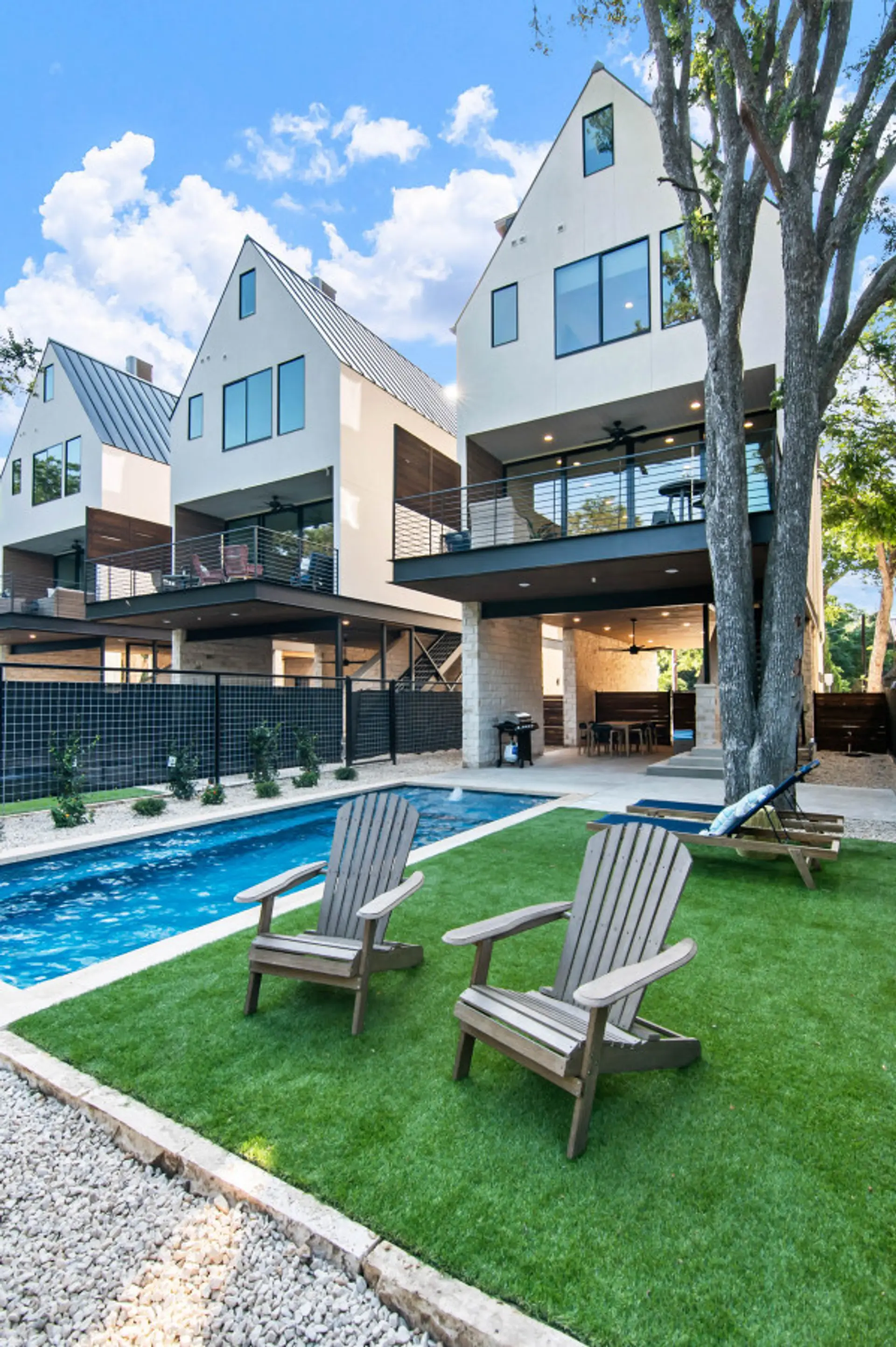 Karnau Haus at Camp Warnecke-Heated pool with outdoor seating and Comal River views