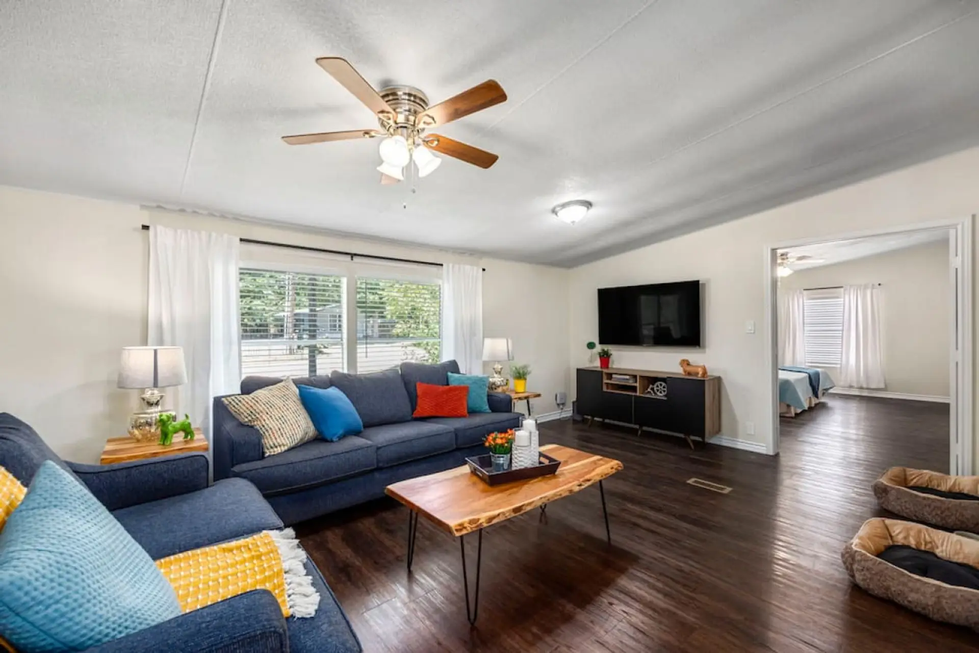 Spacious living room with queen sleeper sofa, Smart TV, and open layout