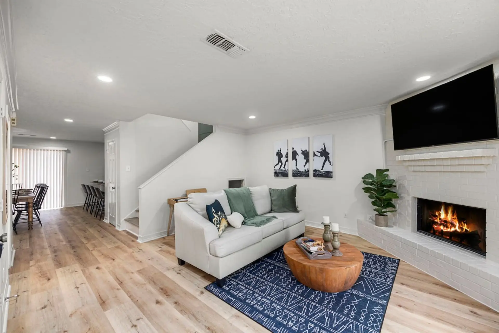 Warm, inviting living room with fireplace and smart TV