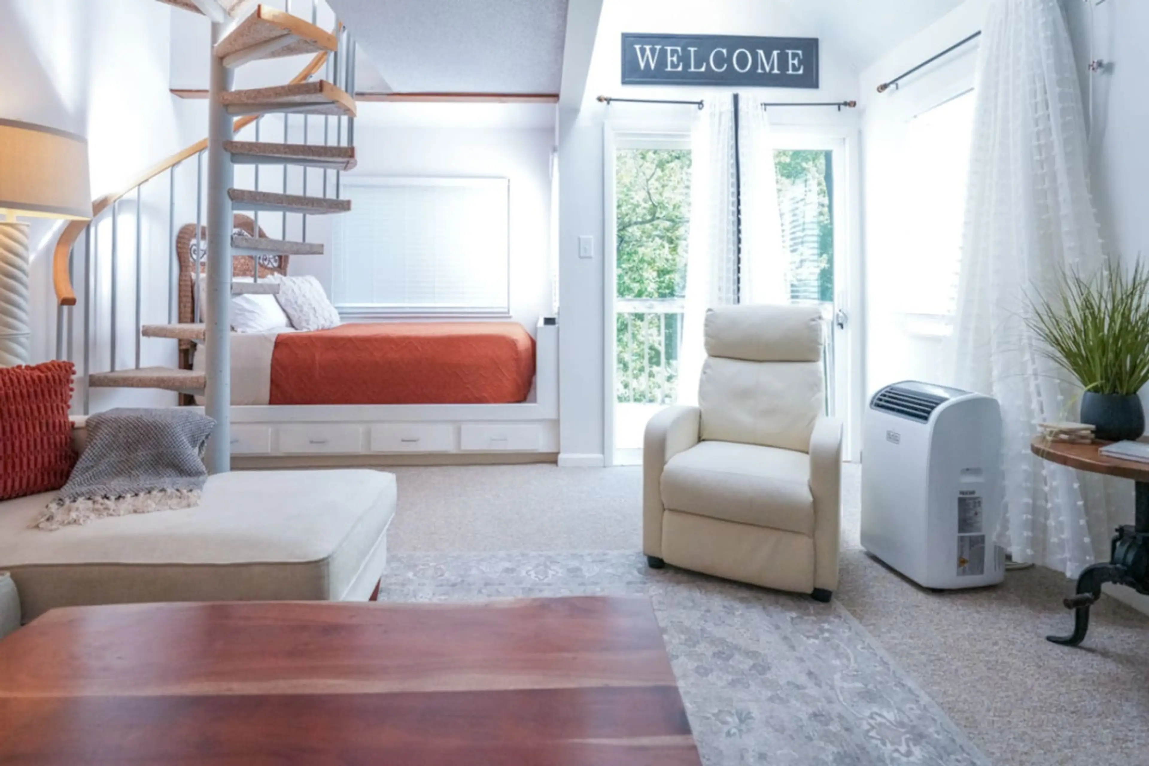 Built in full size bed, with built in storage drawers. Sound machine provided. 32" smart Roku TV. Living Room w/ recliner and sectional. 32" TV.