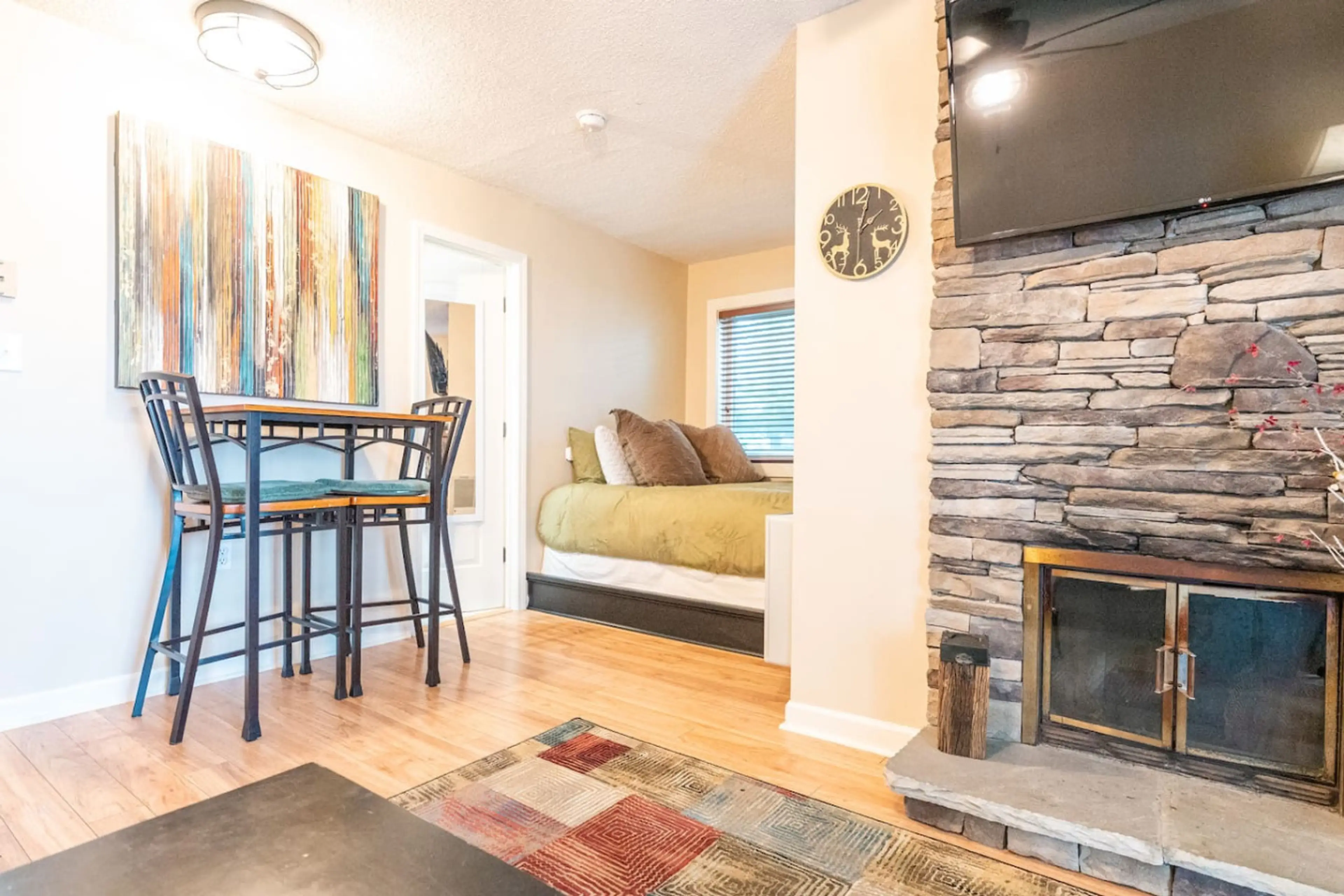 Fireplace NOT functional. Studio w/ full kitchen, queen bed, washer/dryer, 48" Roku Smart TV in living room and 40" Roku Smart TV in bedroom.