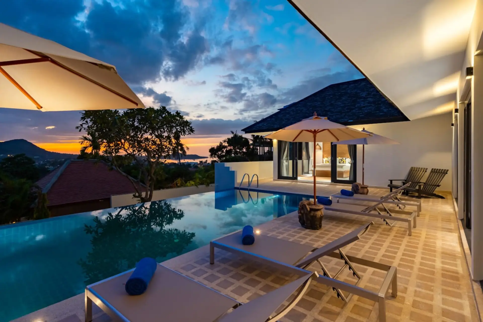 Villa Tramonto - Stunning nighttime exterior with private pool and mountain views