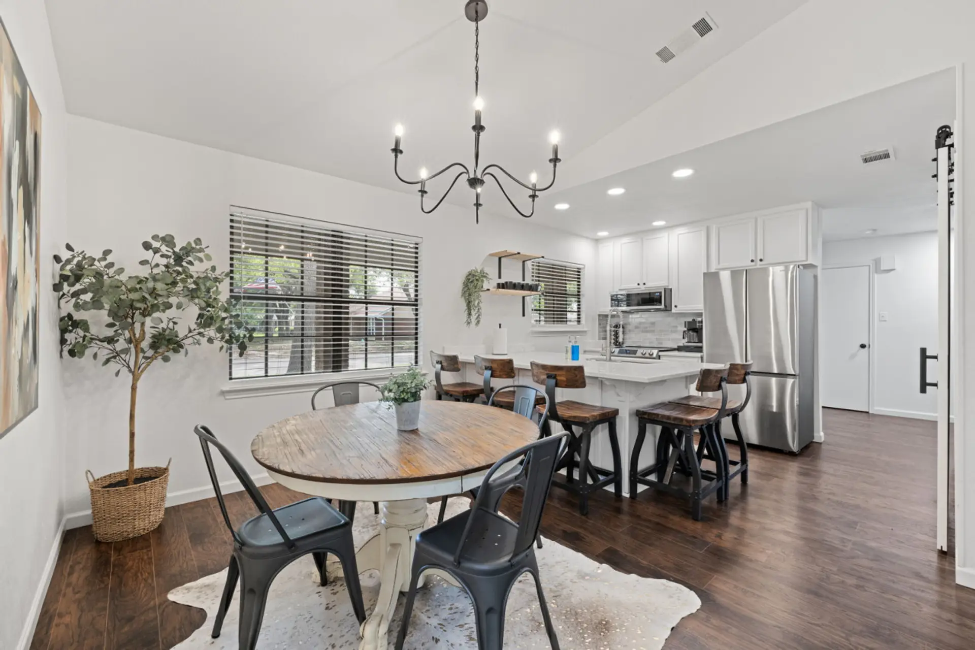 Renovated kitchen with dining table for 4 plus 5 barstools.