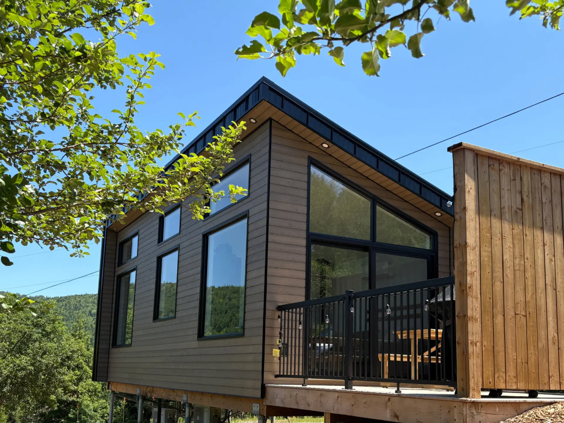 Affordable modern cabin with private deck and stunning mountain backdrop.