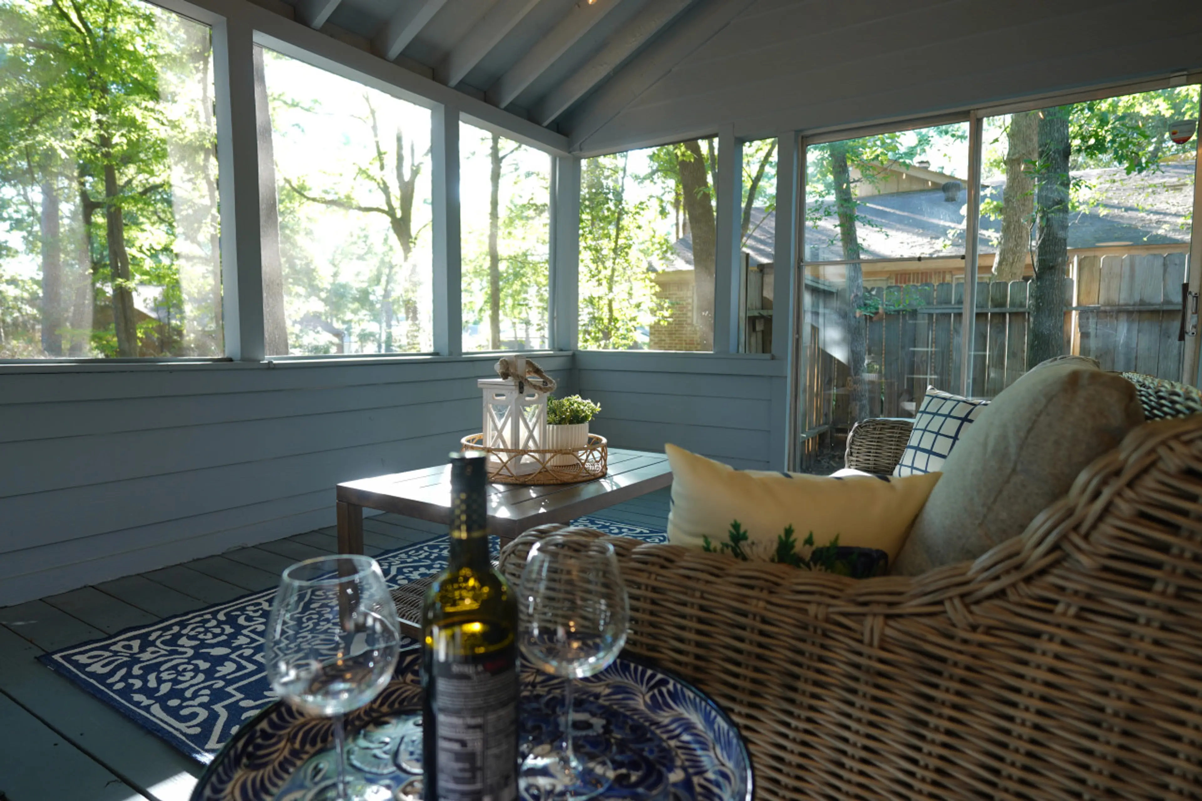 "Relax in our serene screened porch, wrapped in nature's embrace. Sip wine as you soak up the view, the perfect serene getaway to enjoy those quiet, reflective moments."