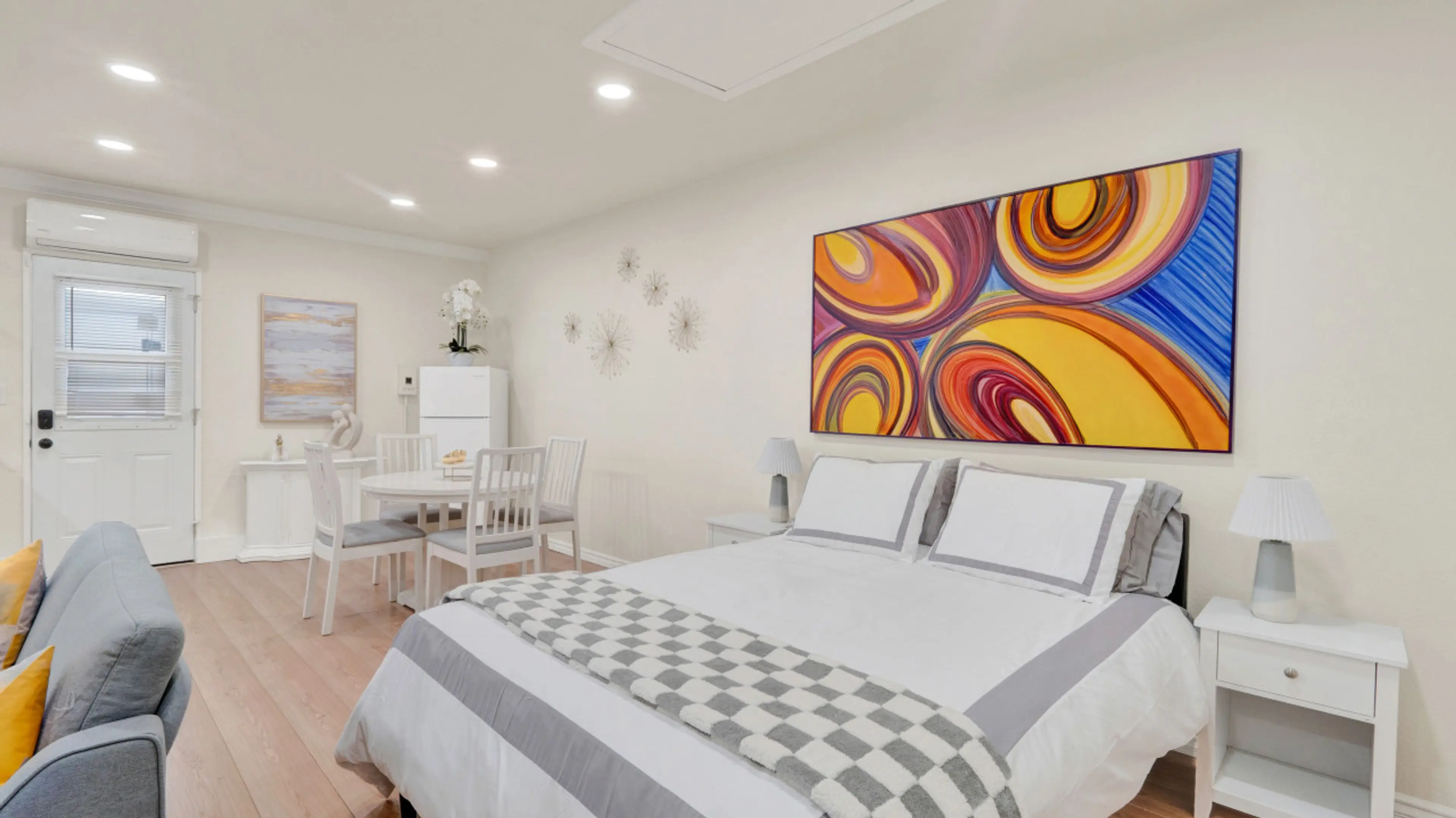 Bright and cozy studio with modern decor and vibrant artwork – perfect for a relaxing stay! Features a comfy queen bed, stylish dining area, and all the essentials for a comfortable getaway.