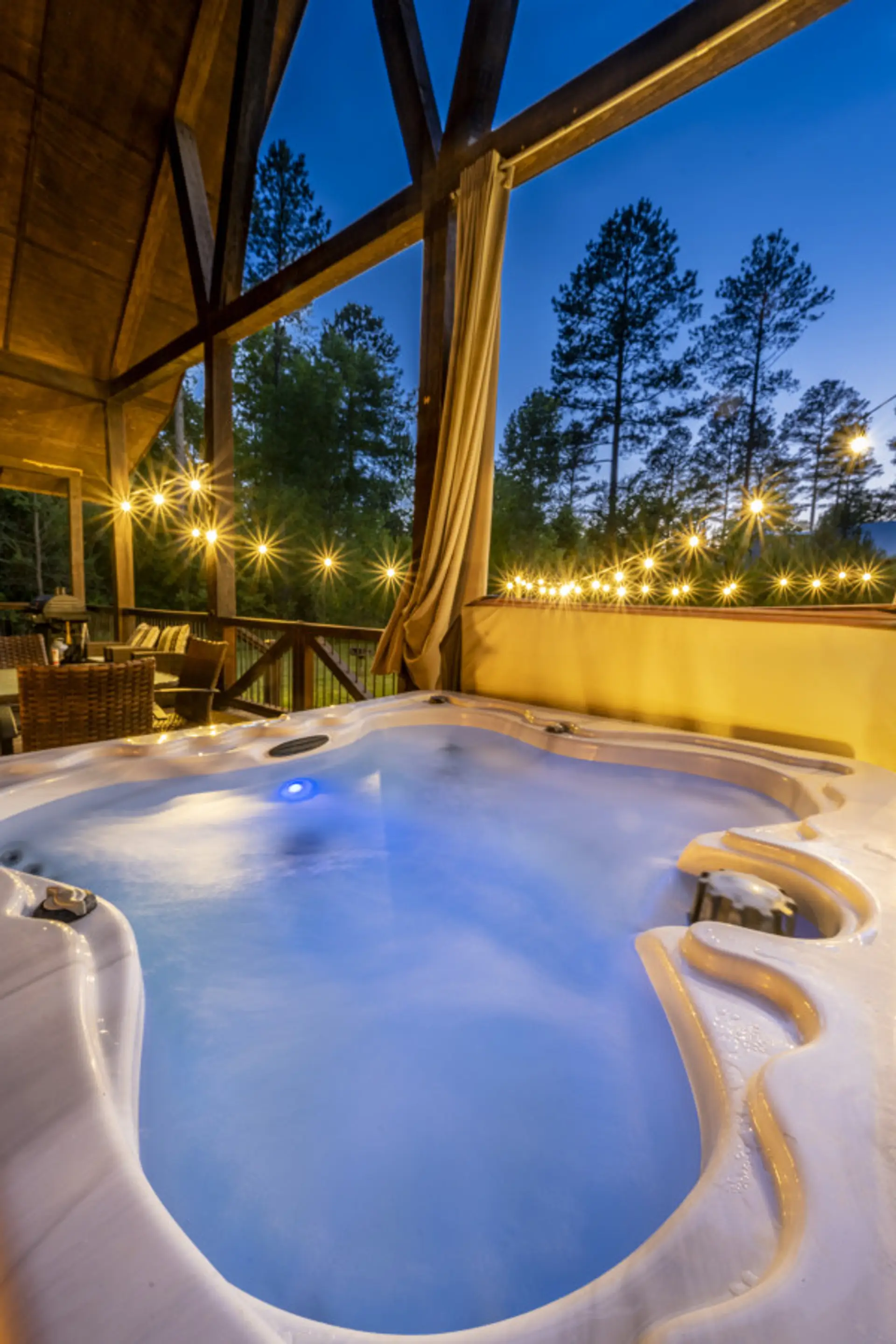 Indulge in Daydream Chalet's hot tub oasis, where you can soak in bliss while basking in the captivating embrace of nature's beauty.