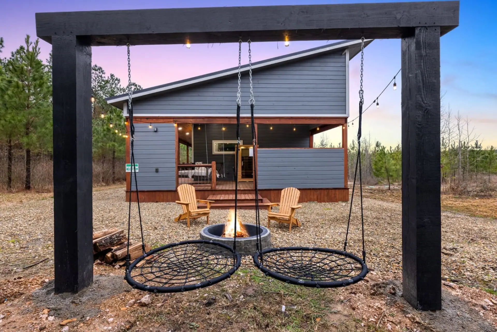 Swing into the evening under the stars and watch the fire pit glow as the sky turns purple—this is what relaxing actually looks like.